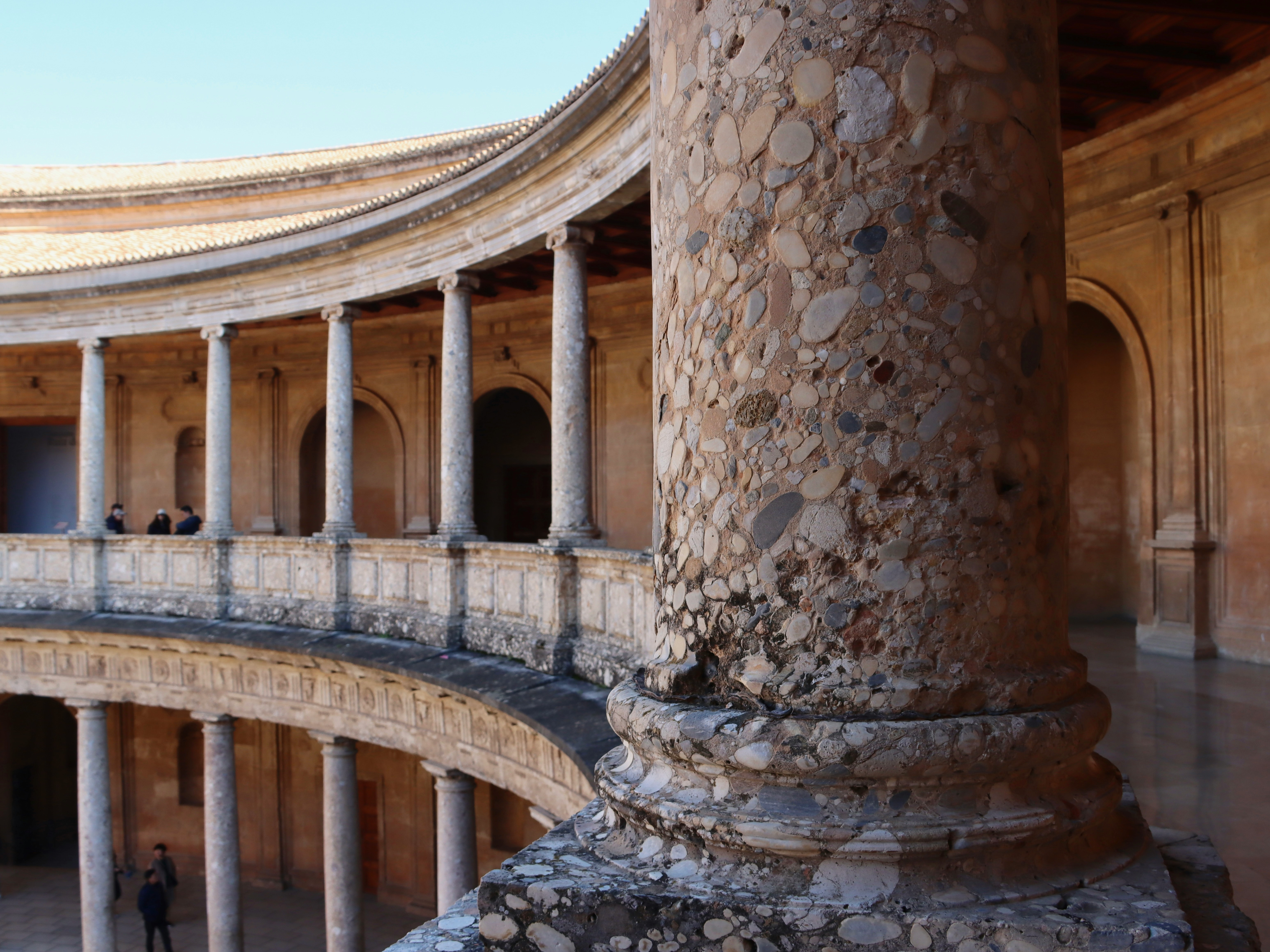 a-stone-column-and-a-balcony-structure