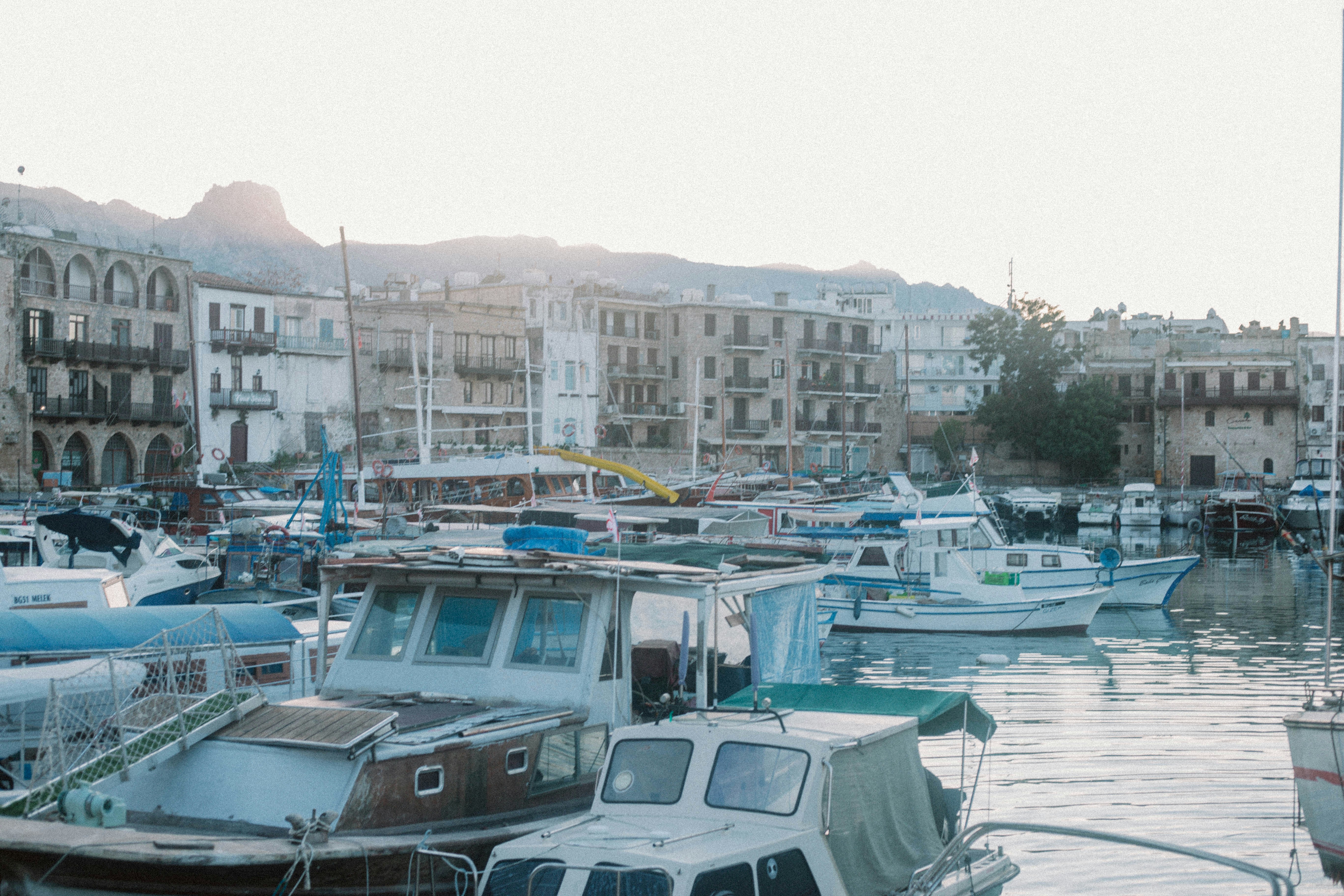 a-harbor-filled-with-lots-of-boats-next-to-tall-buildings