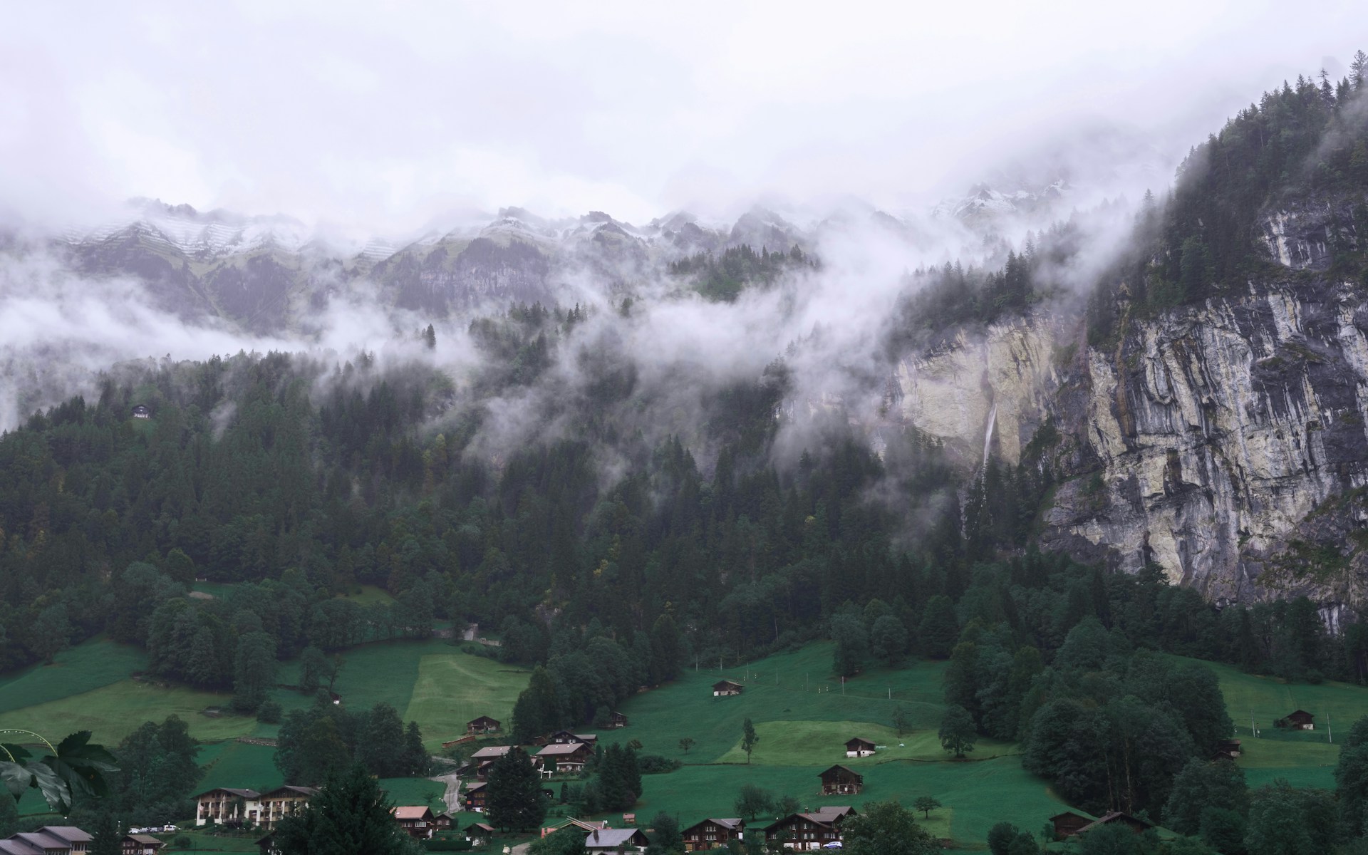 a-view-of-a-valley-with-a-mountain-in-the-background