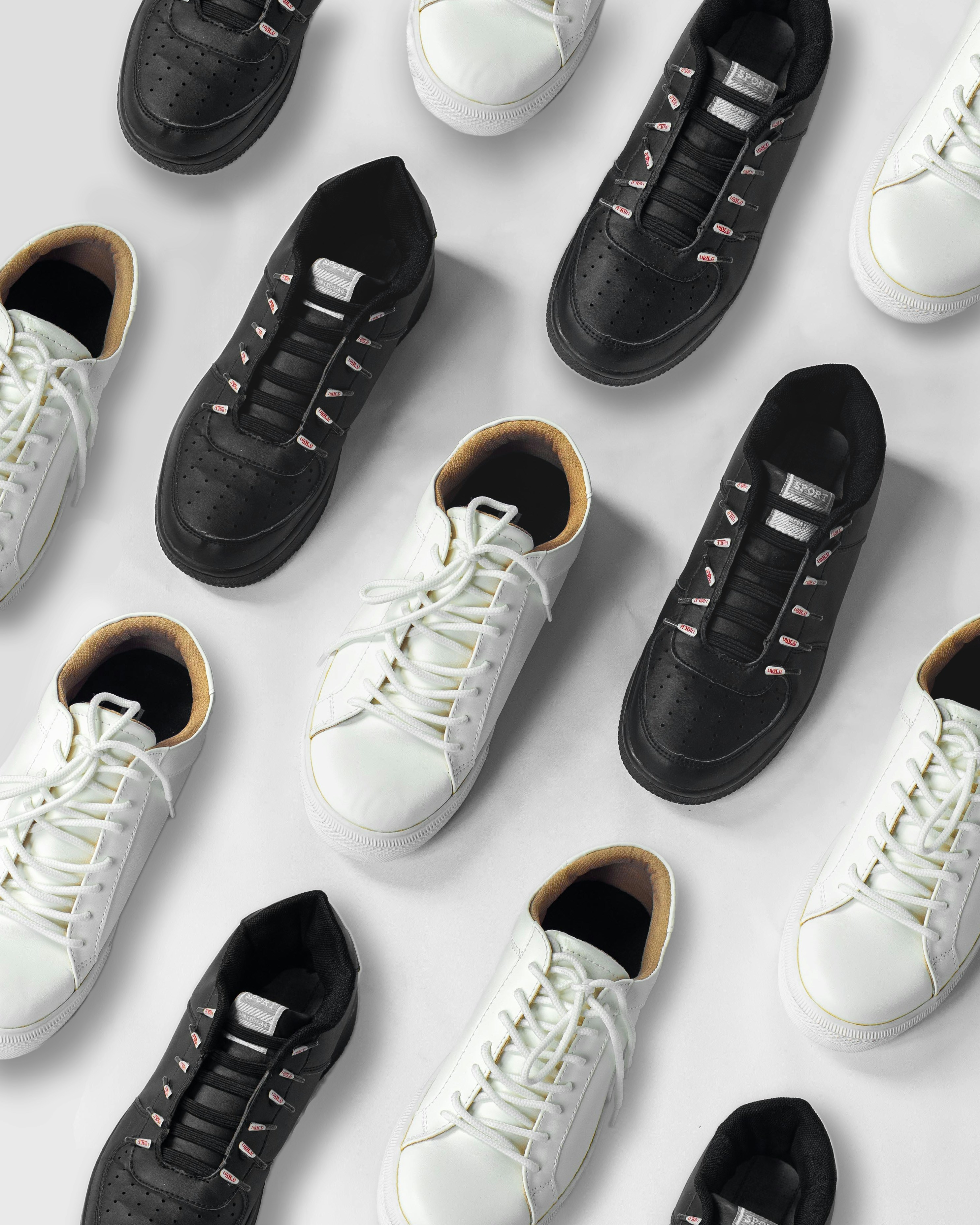 White and black sneakers displayed against a white background.