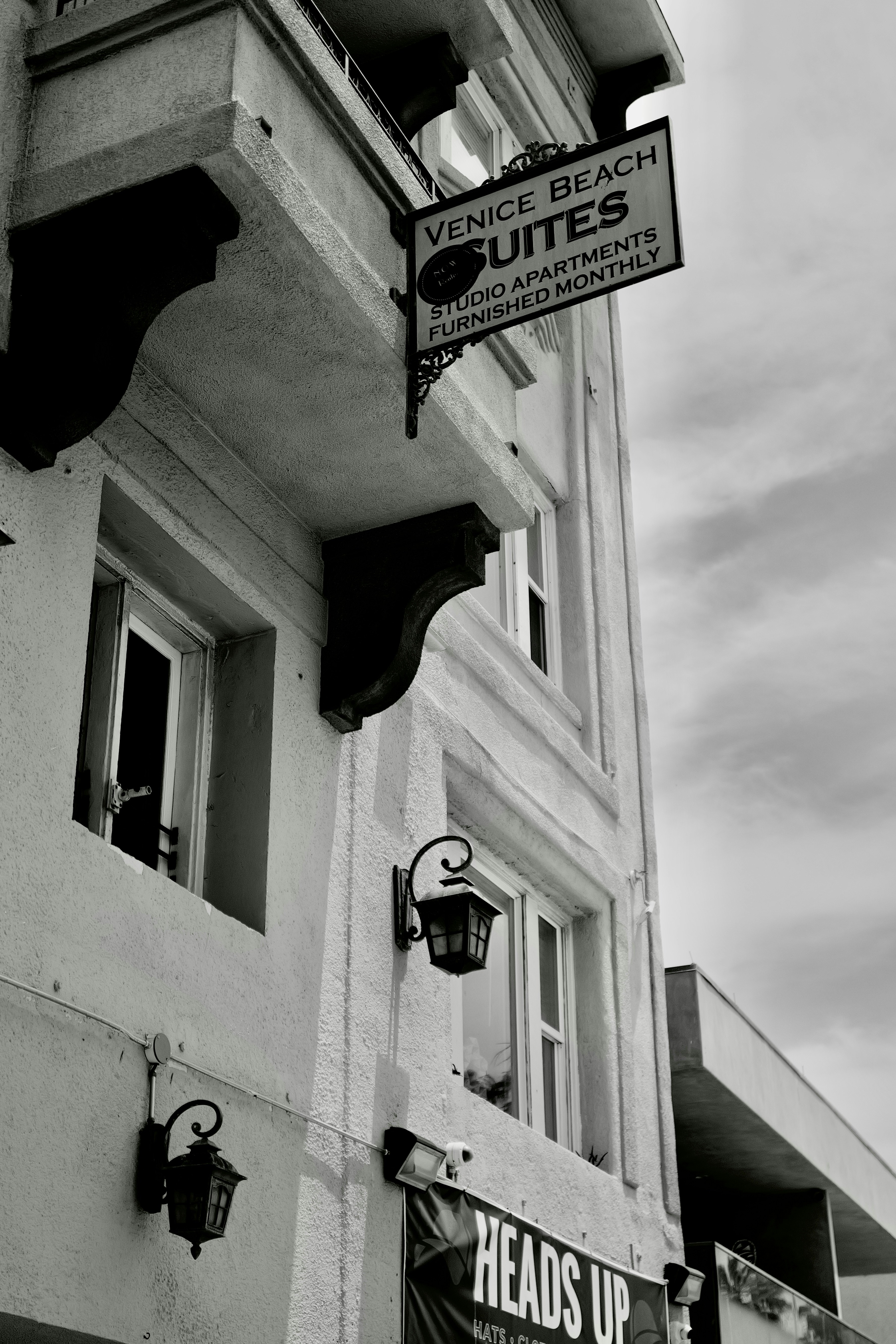 A picture presents a building with a Venice Beach Suites sign.