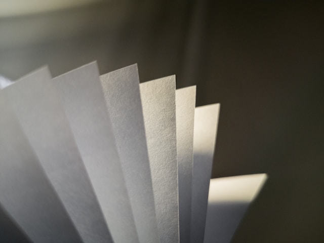 White paper on gray surface.