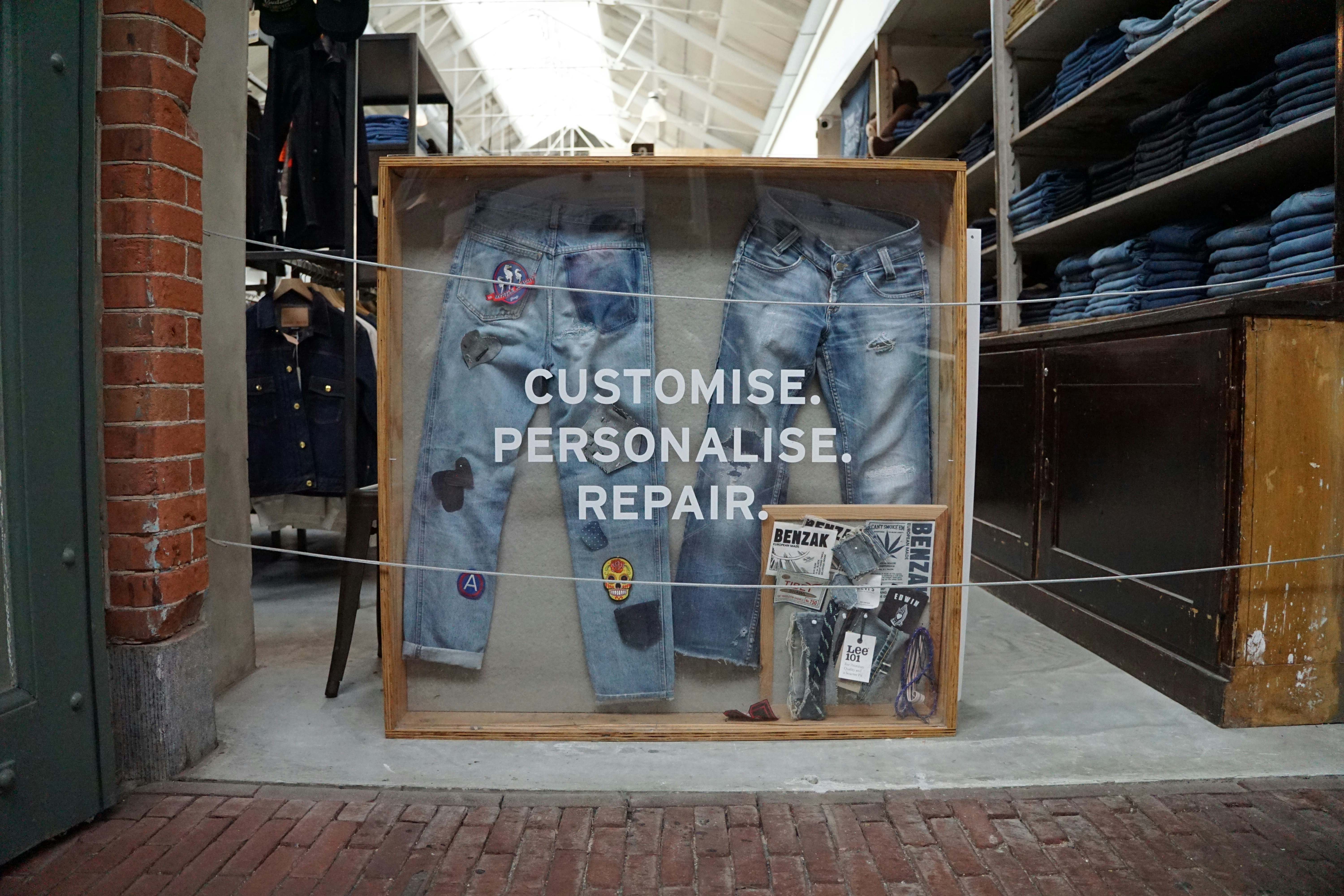 frame containing jeans with patches 