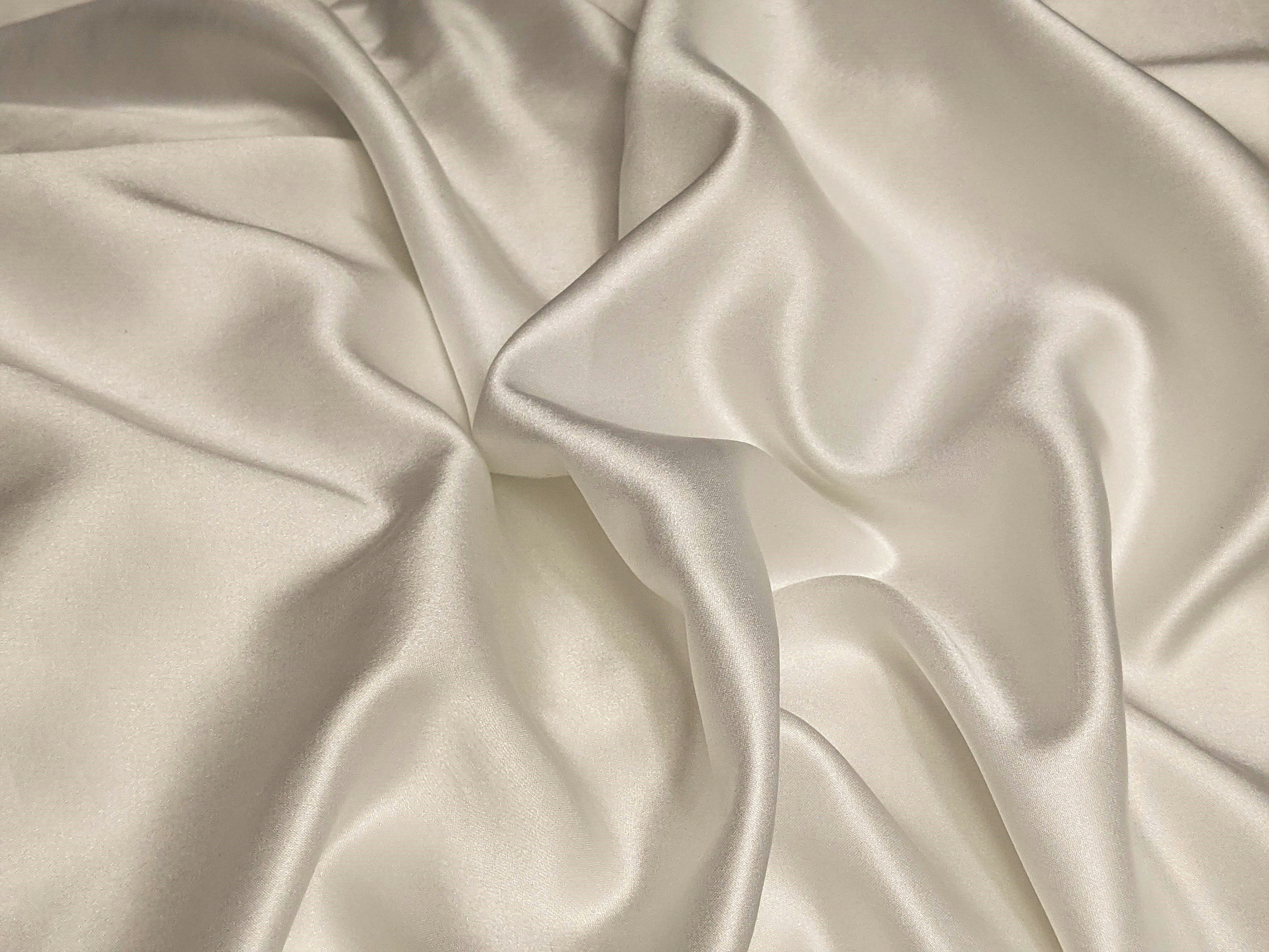 close up of beige silk fabric 
