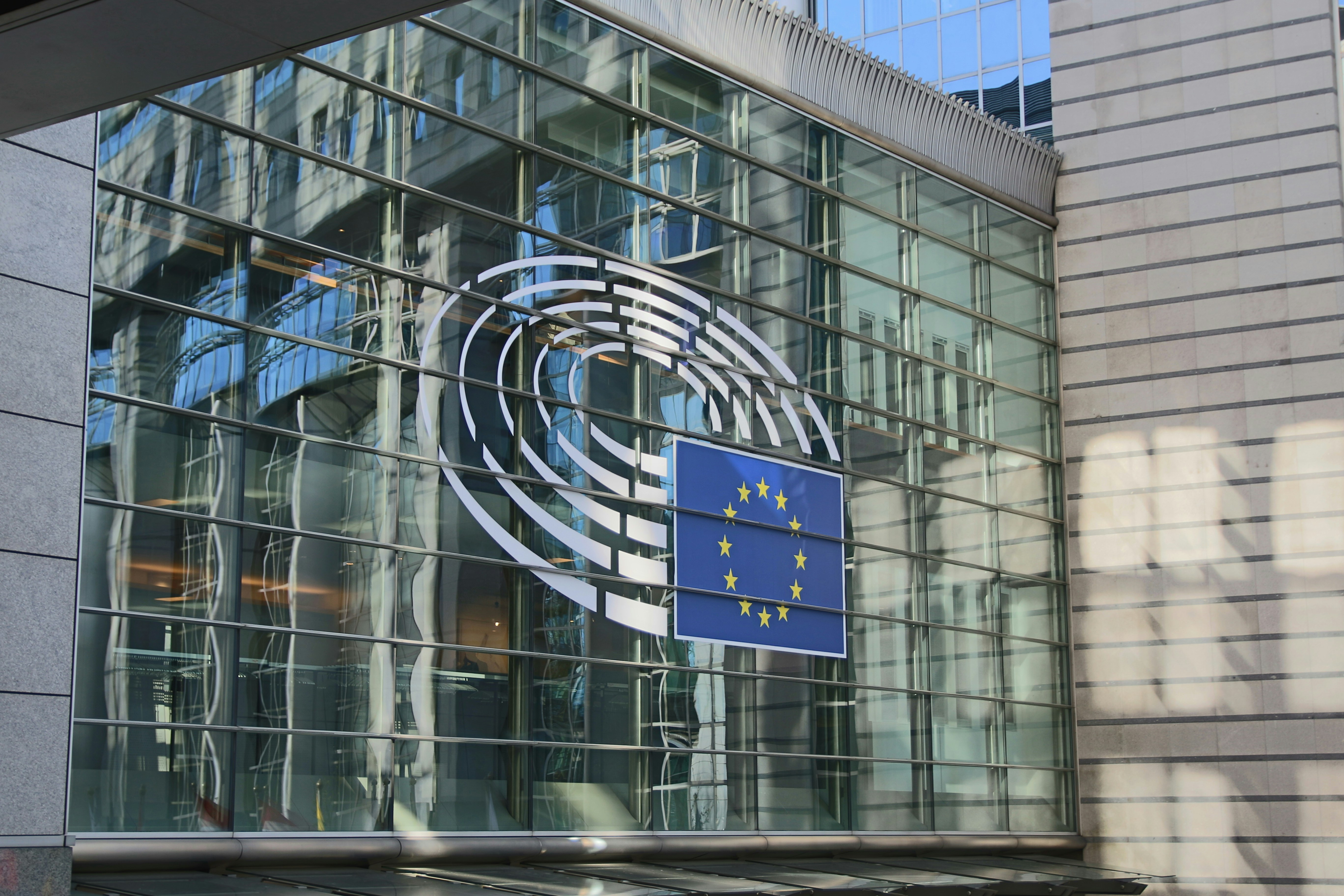 glass walled building with EU flag