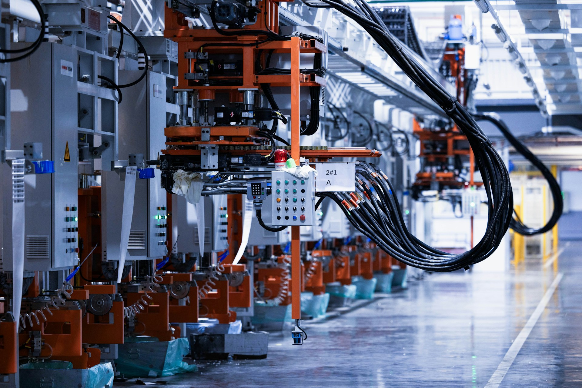 The photo presents an automated industrial production line.