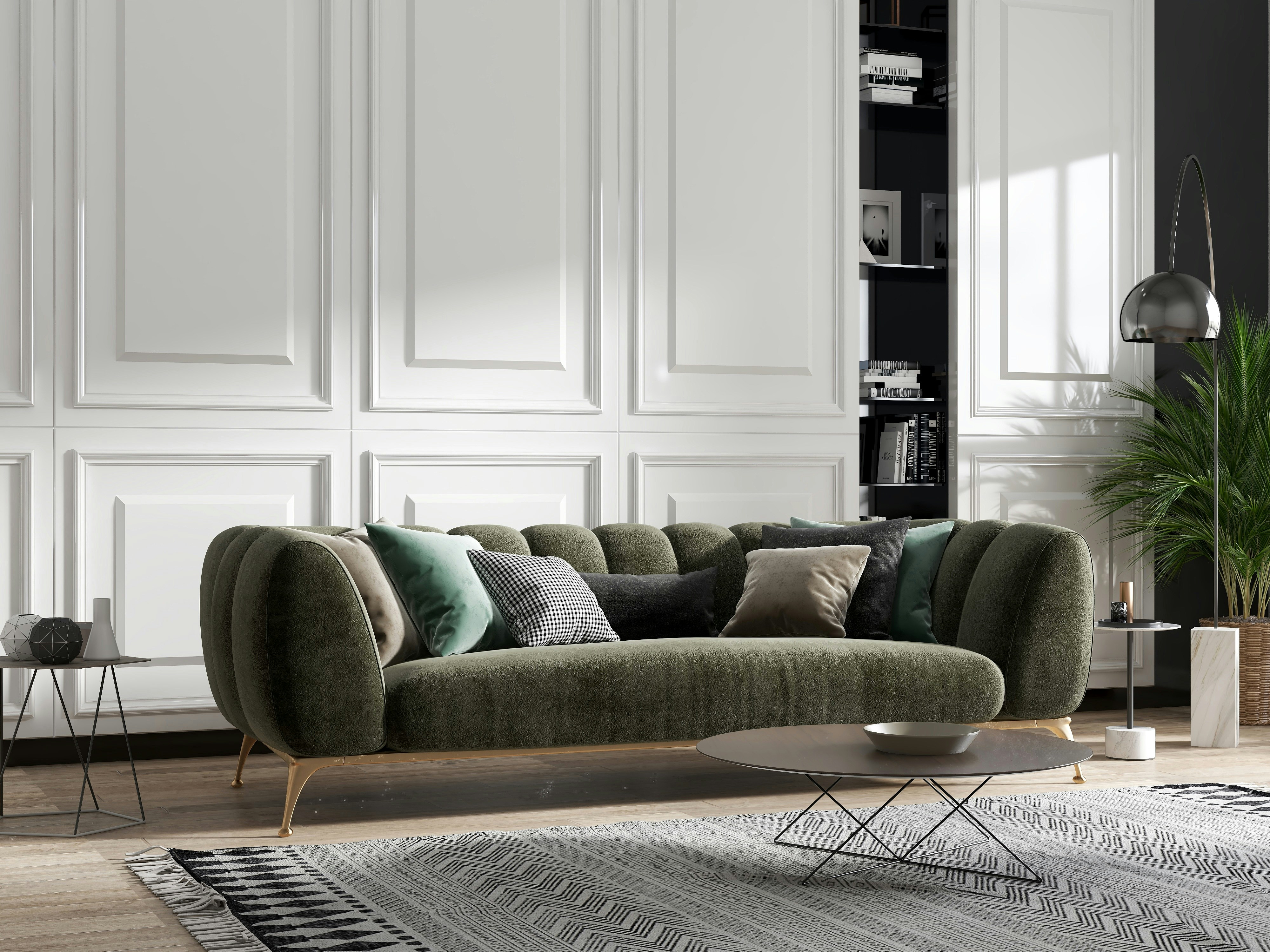 Modern living room with a green upholstered sofa, decorative cushions, a patterned rug and contemporary interior accessories.