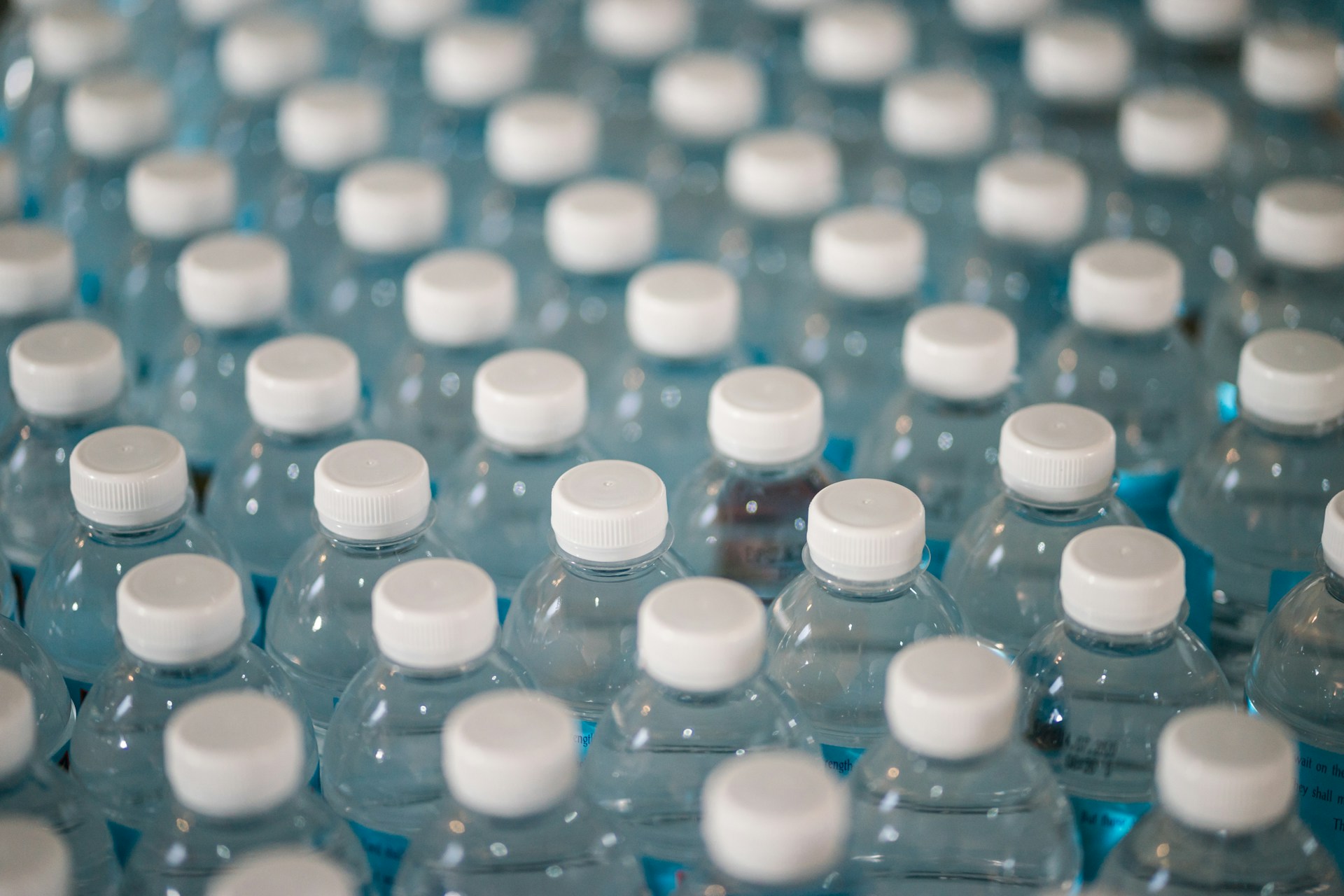 The photo presents many plastic bottles.