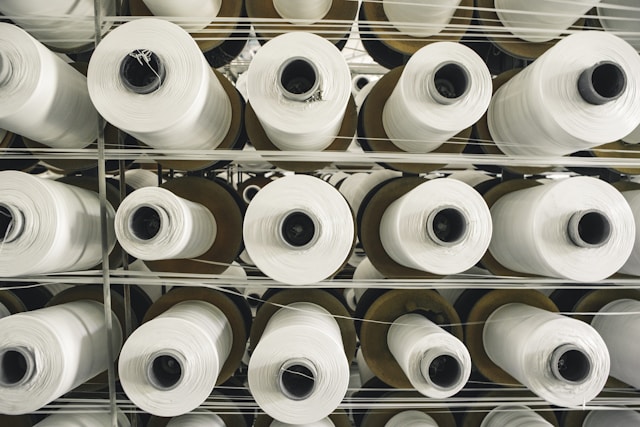 A rack of rolls of white paper in a store.
