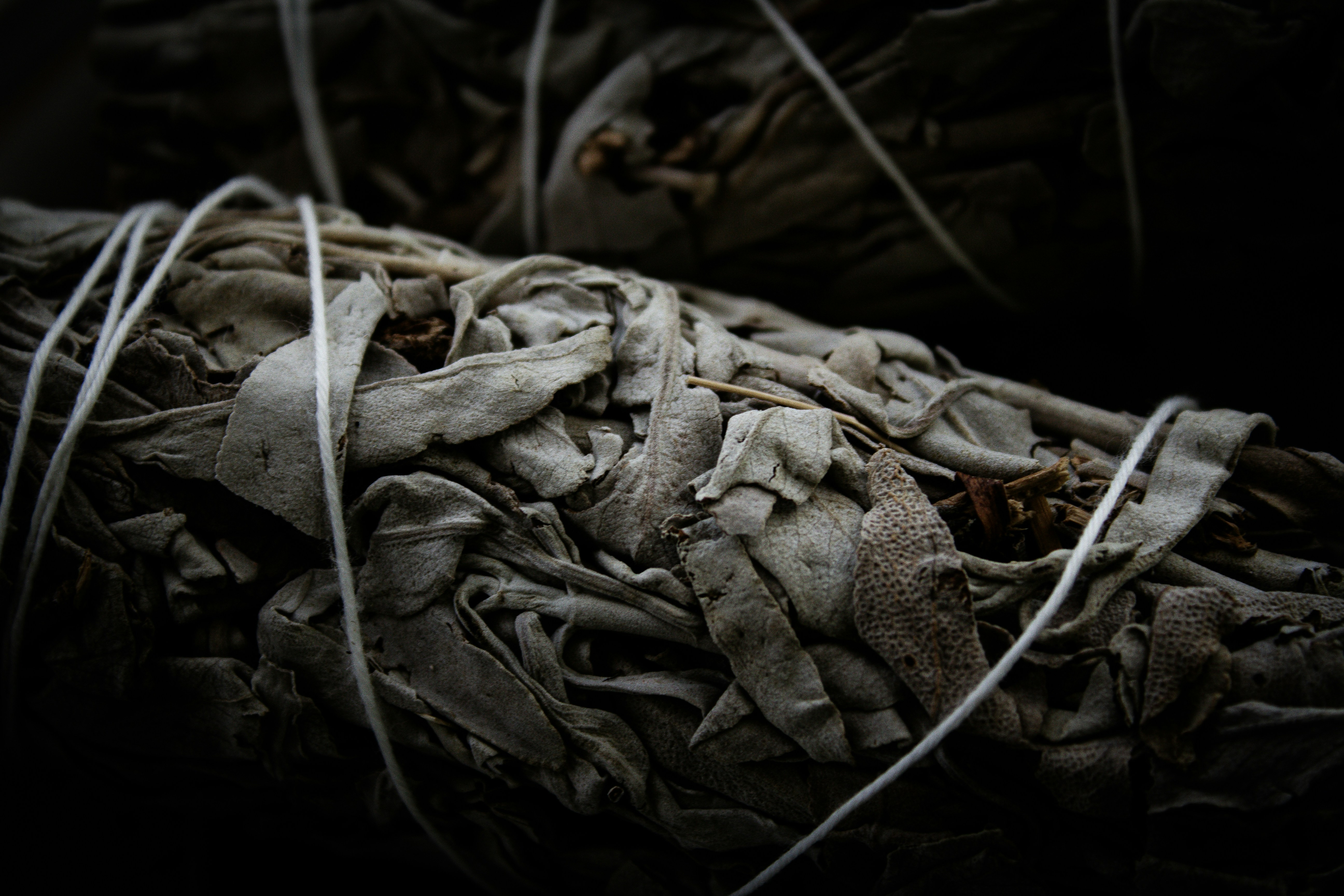 A pile of grey textile scraps and discarded fabric pieces.