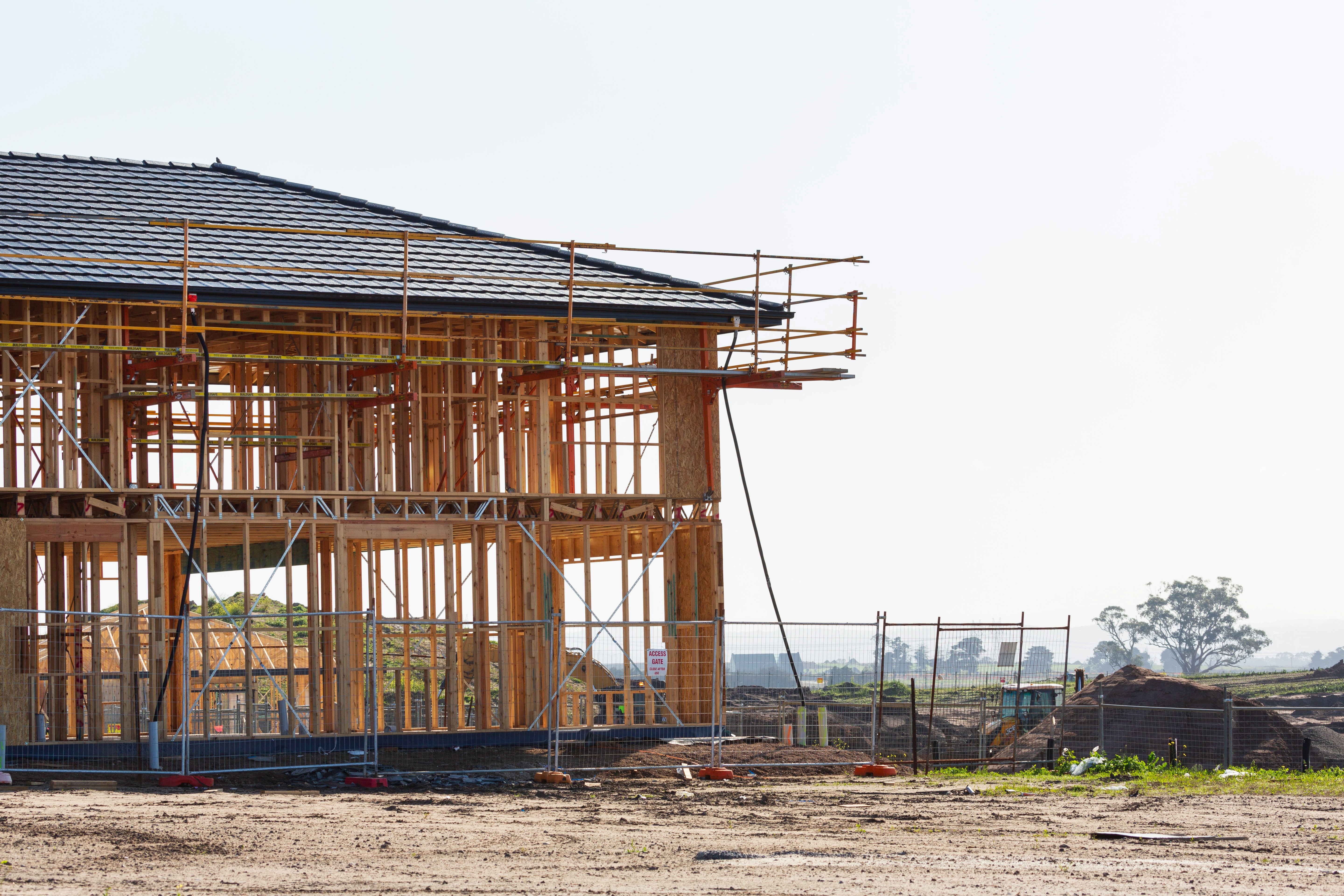 The picture shows construction activity on a building site.  