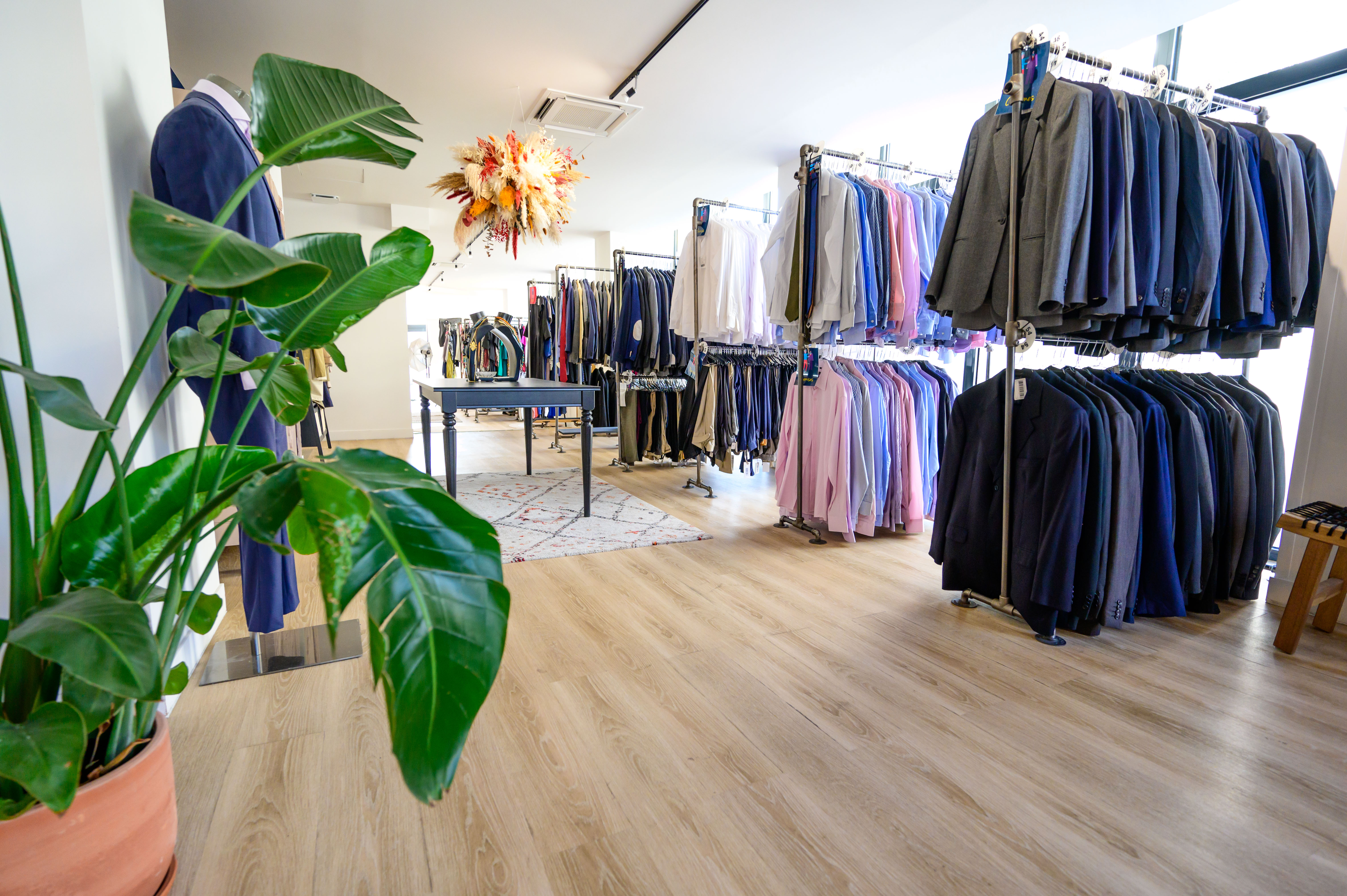 Clothing selection area at La Cravate Solidaire in Paris