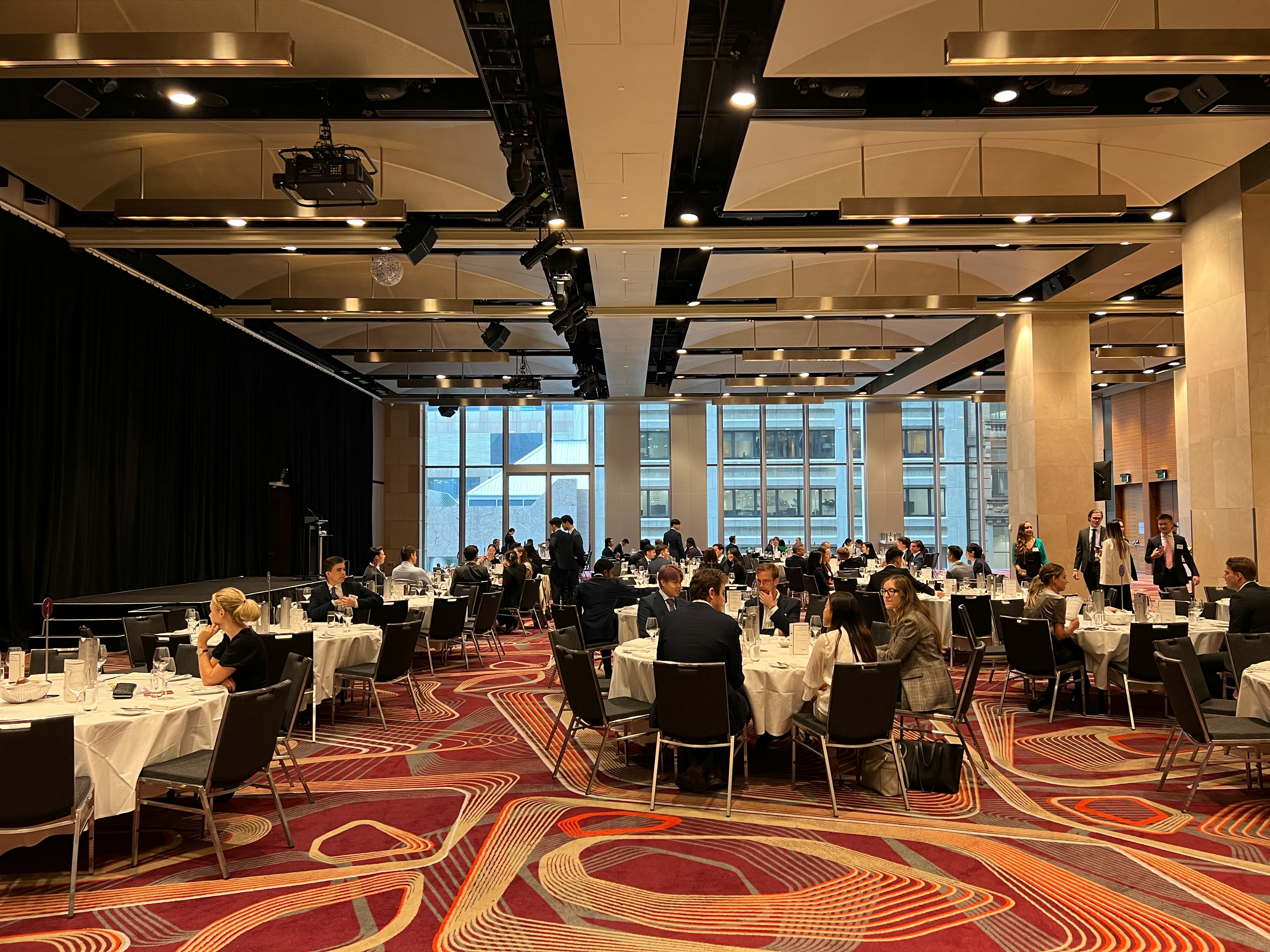 A group of people sitting at tables.