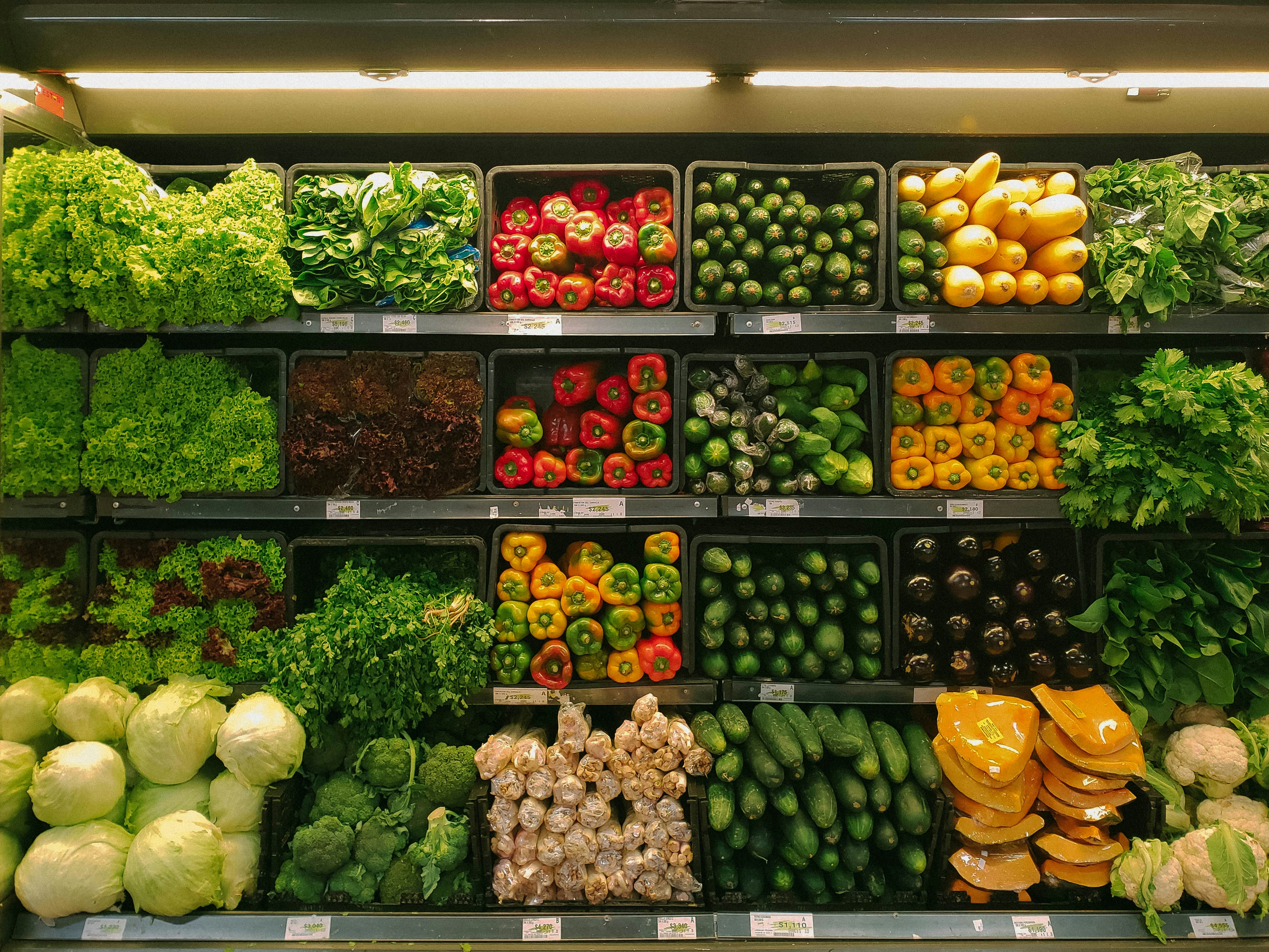 The picture presents vegetables in the boxes.