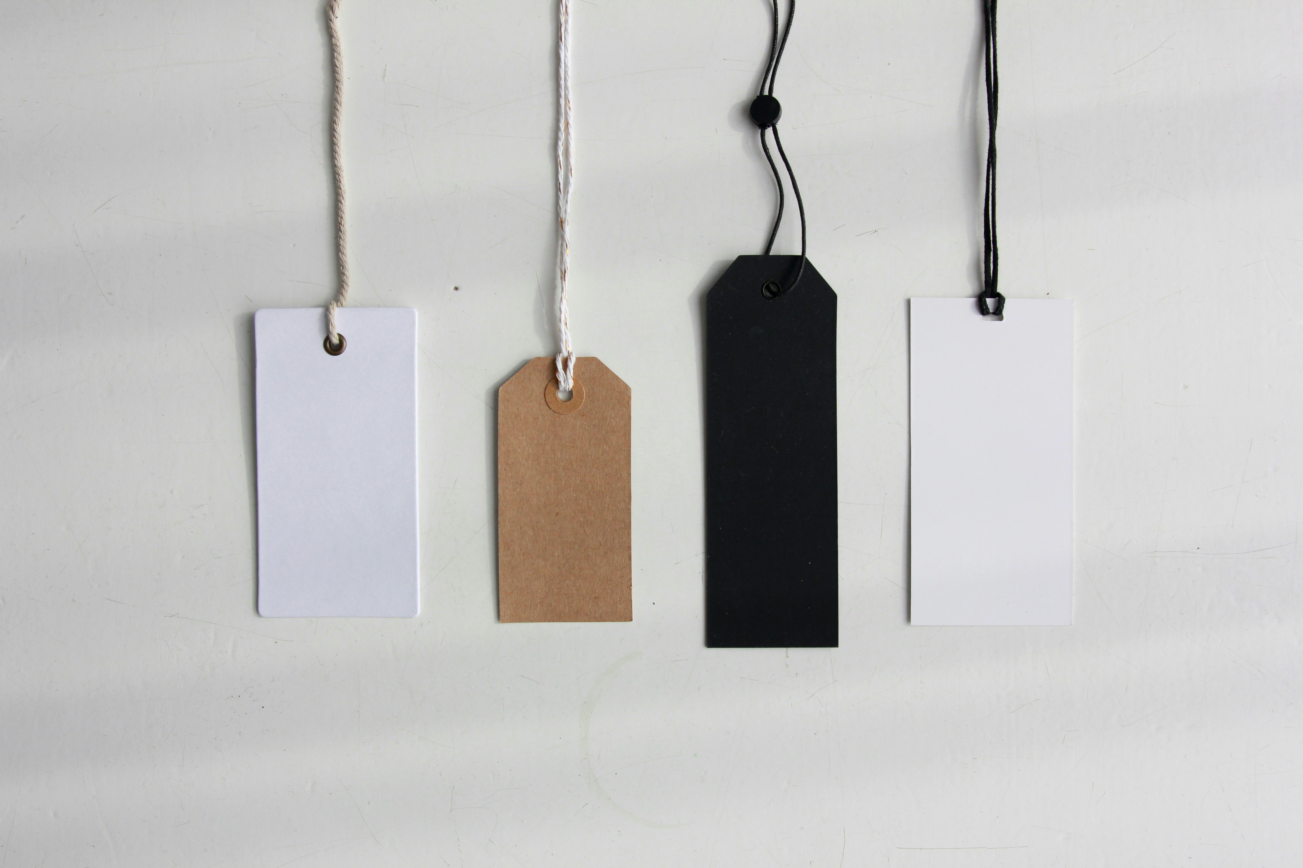 Four paper card tags.