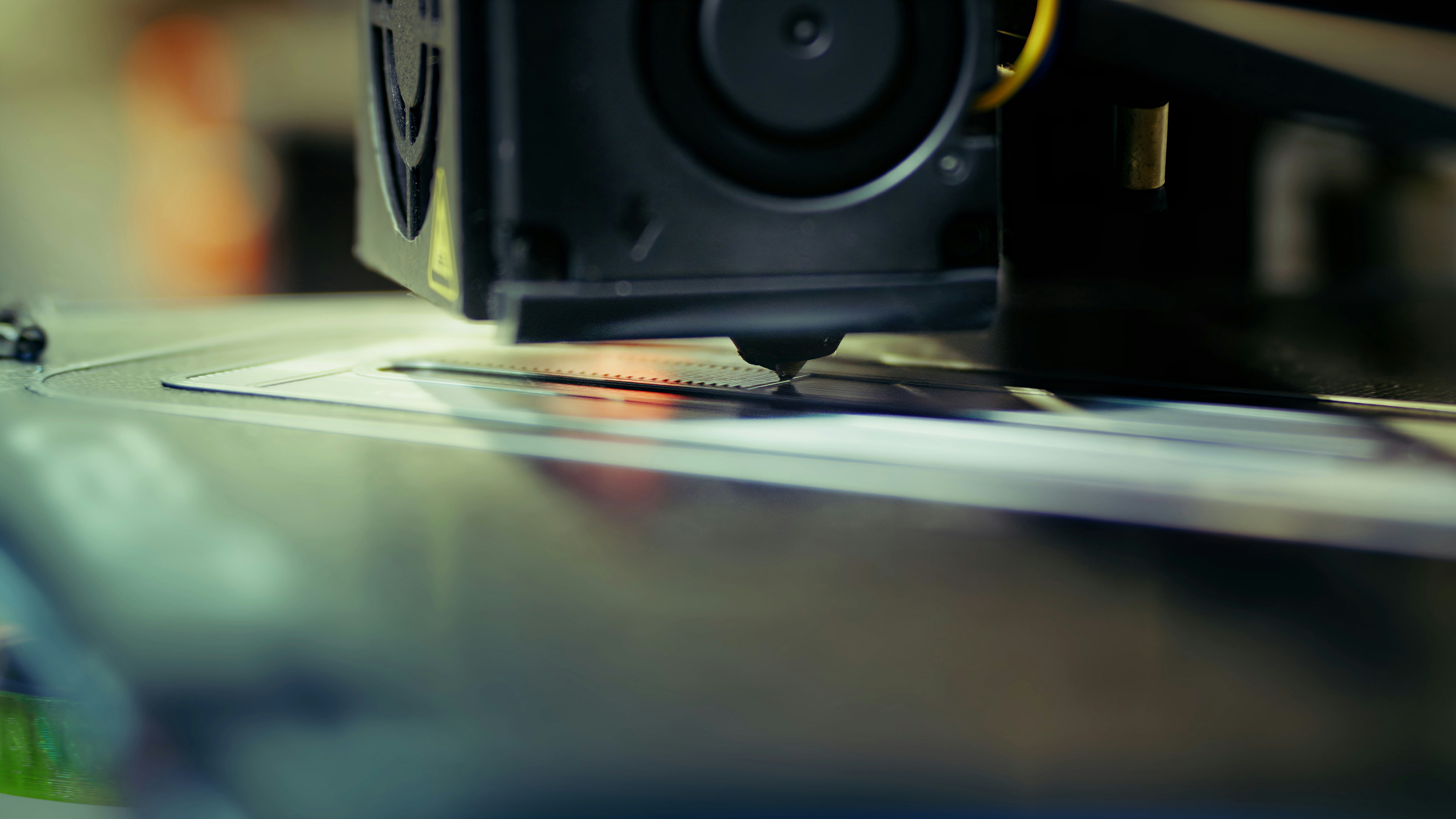 A close up of a 3D Machine on a table.