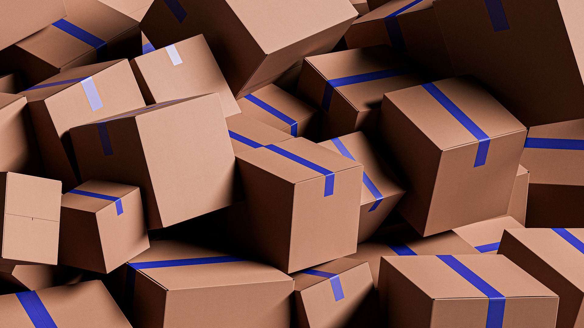 The photo presents a pile of cardboard boxes.