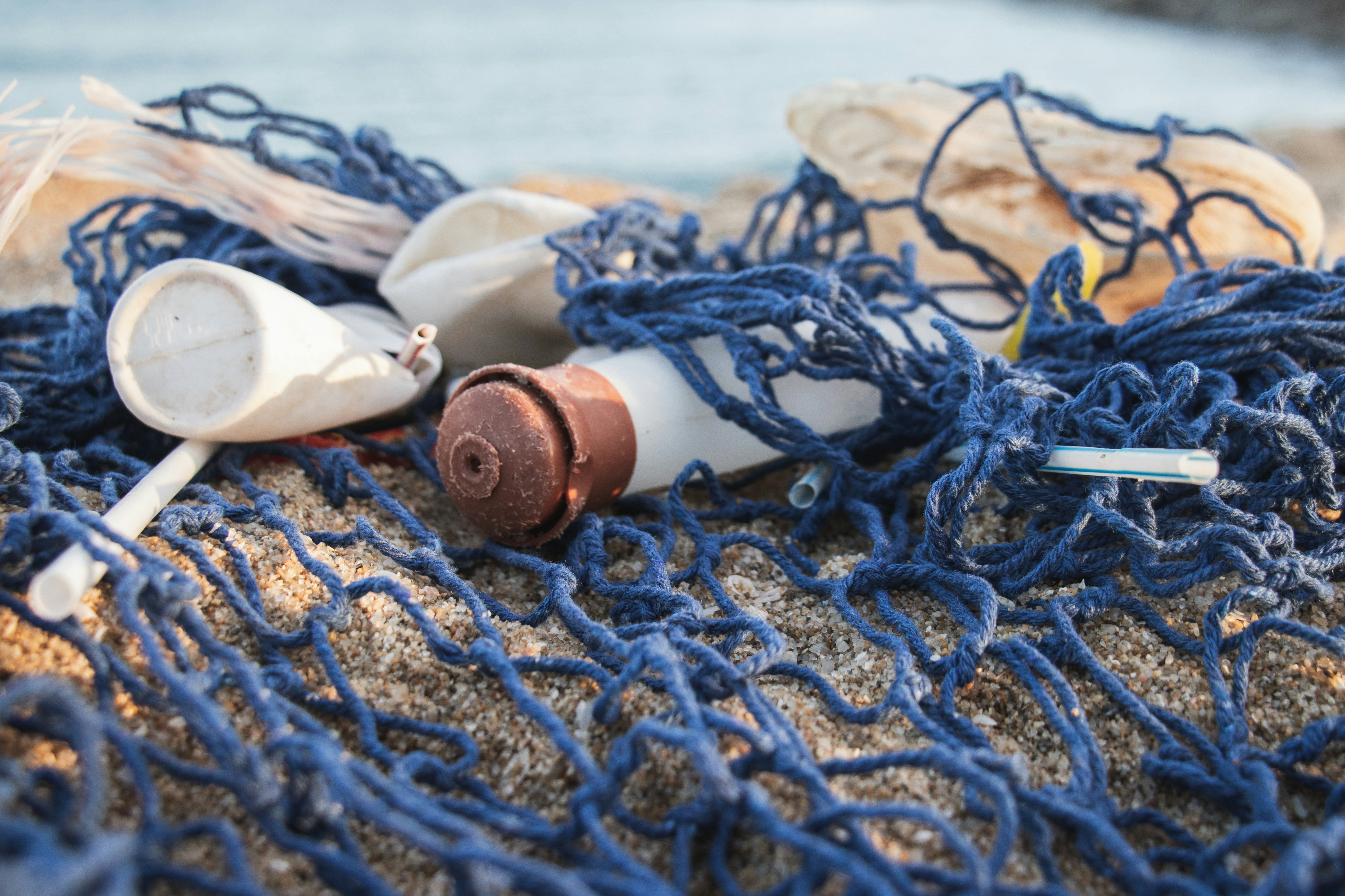 An illustrative photo of plastic bottles arranged on a net