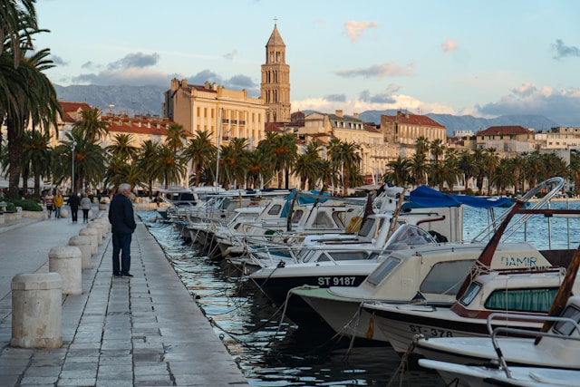 An illustrative photo of a waterfront promenade with boats in Croatia