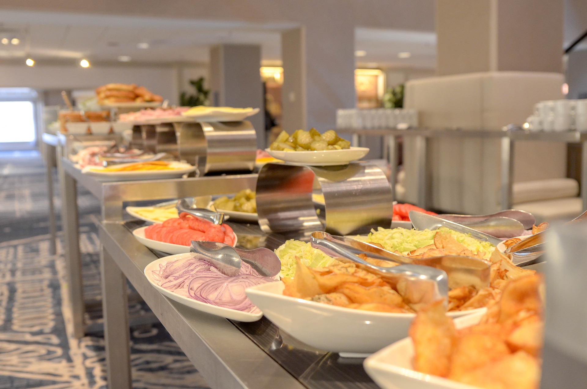 An illustrative photo of a buffet table with lot of dishes