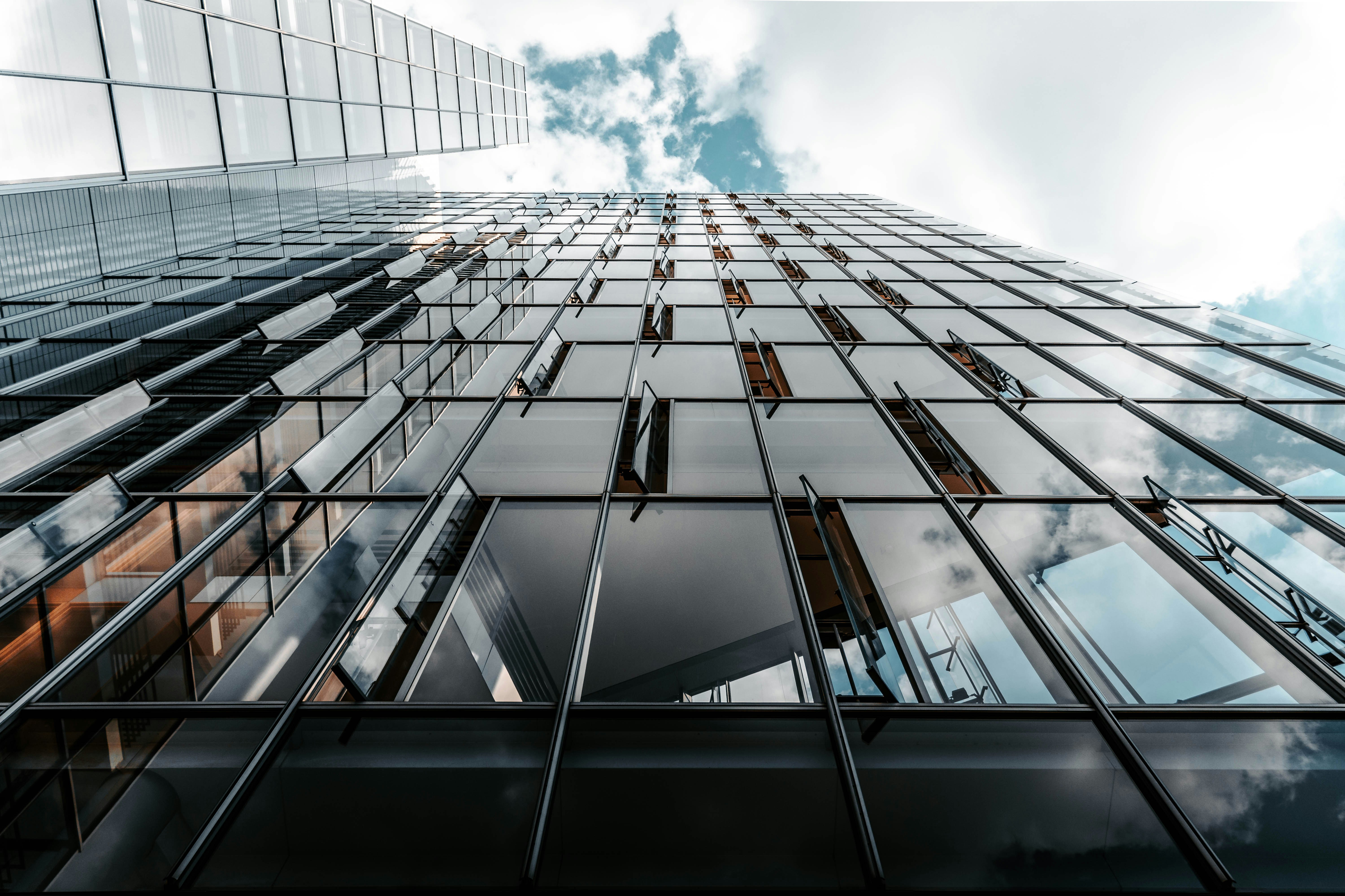 An illustrative photo of a modern glass office building