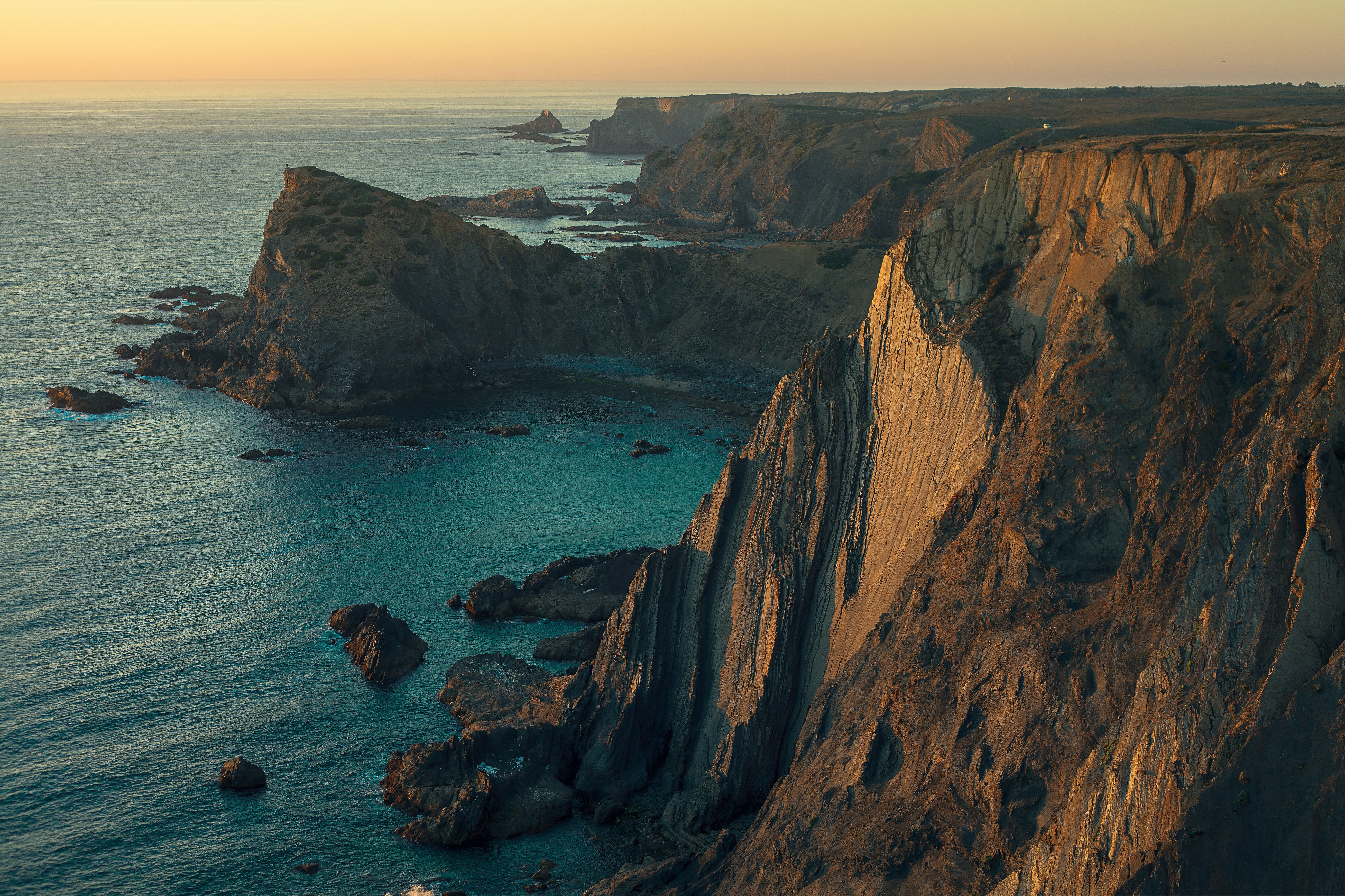 An illustrative photo of coastal landscape during sunrise 