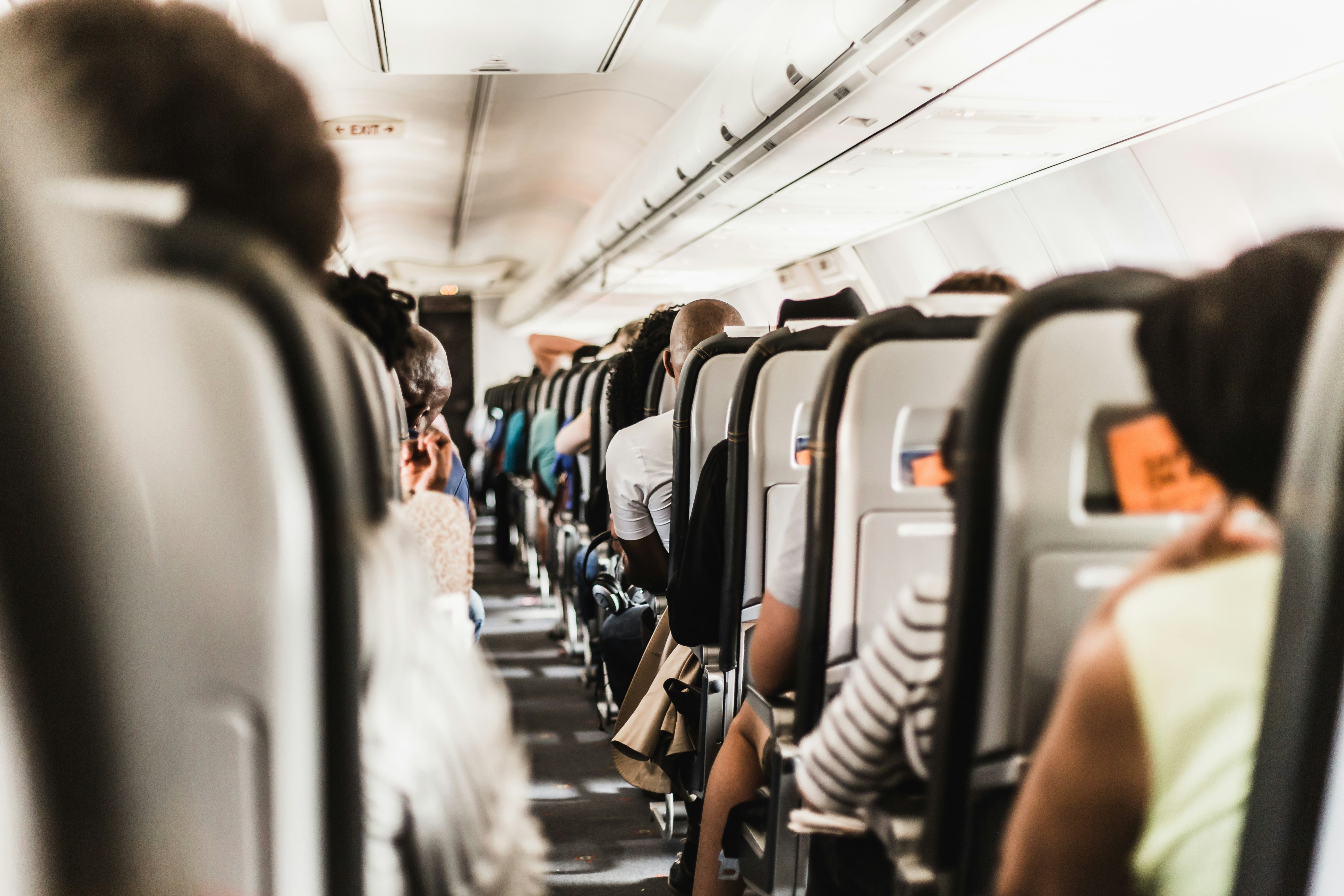 Photo by Unsplash An illustrative photo of people seating in vehicle.