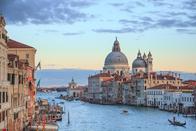 An illustrative photo of a daytime view of Venice, Italy, showcasing its iconic canals and historic buildings