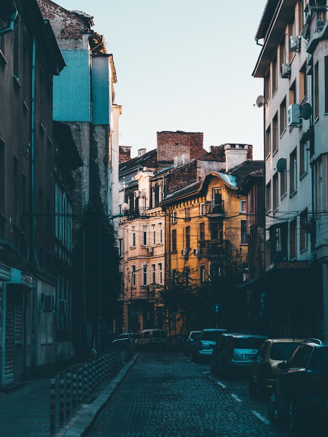 An illustrative photo of a narrow street in an urban environment