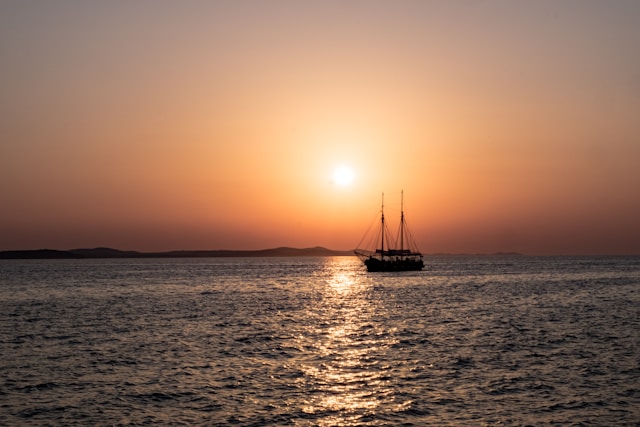 An illustrative photo of a sunset over a body of water