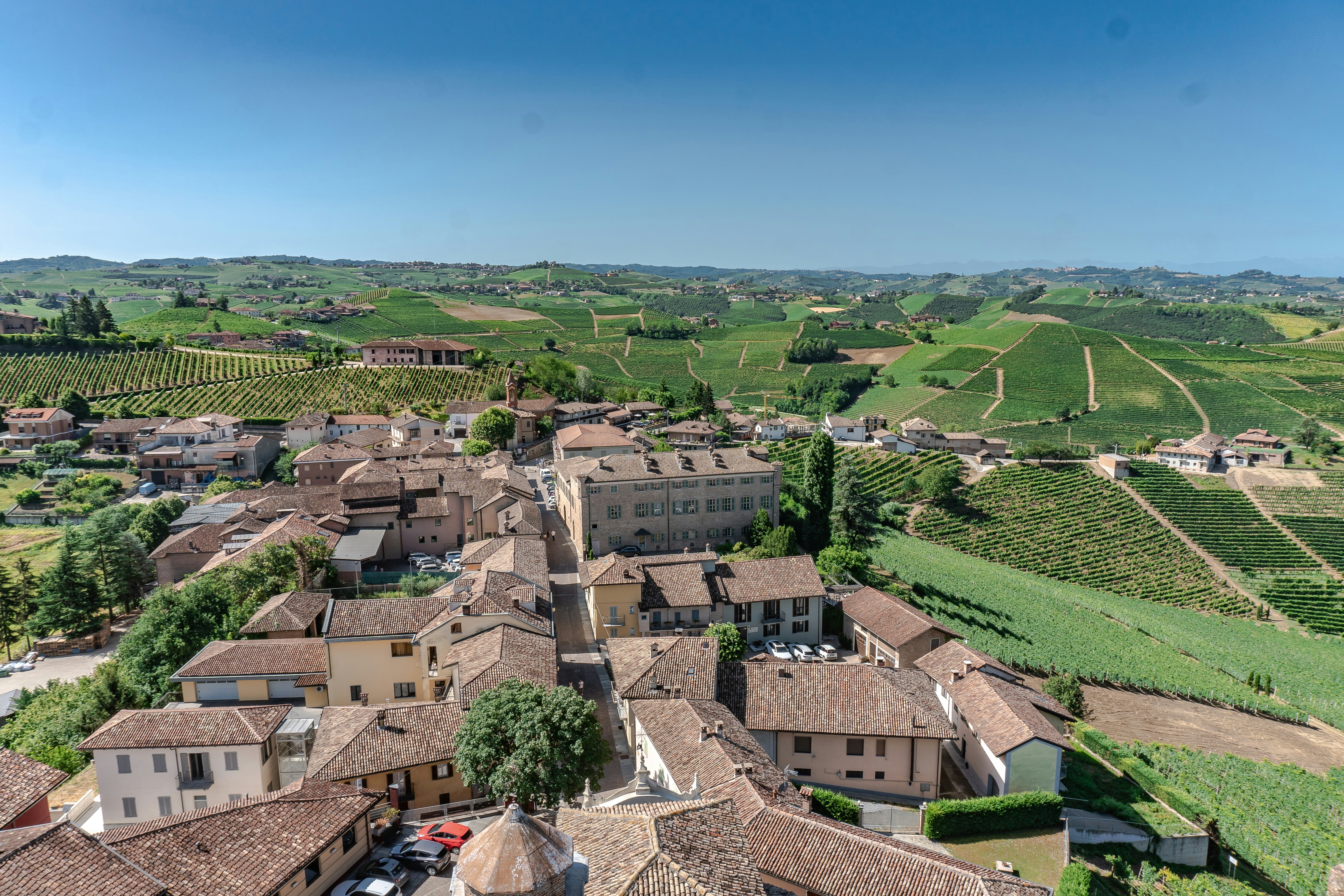 An illustrative photo of a rural landscape with buildings in Italy