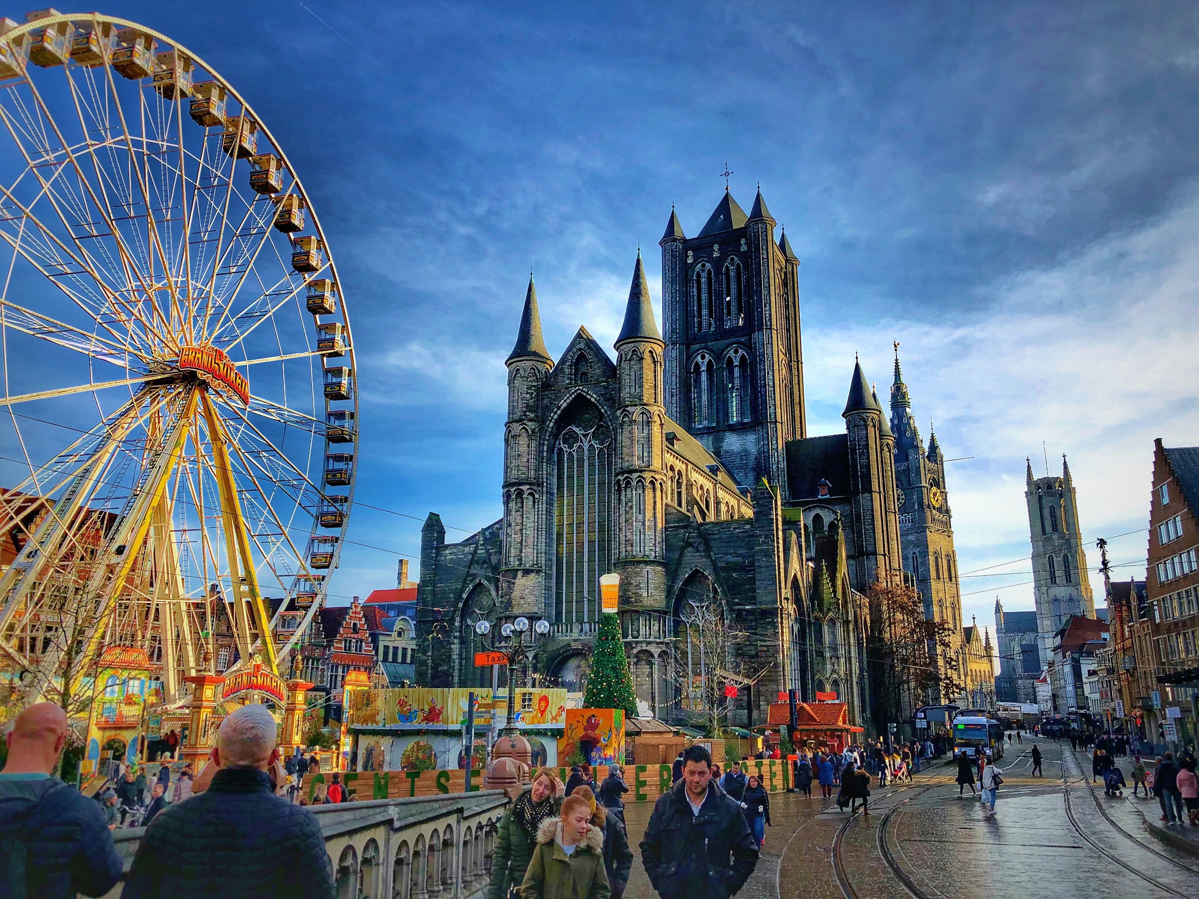 Photo by Unsplash An illustrative photo of people walking near a ferris wheel