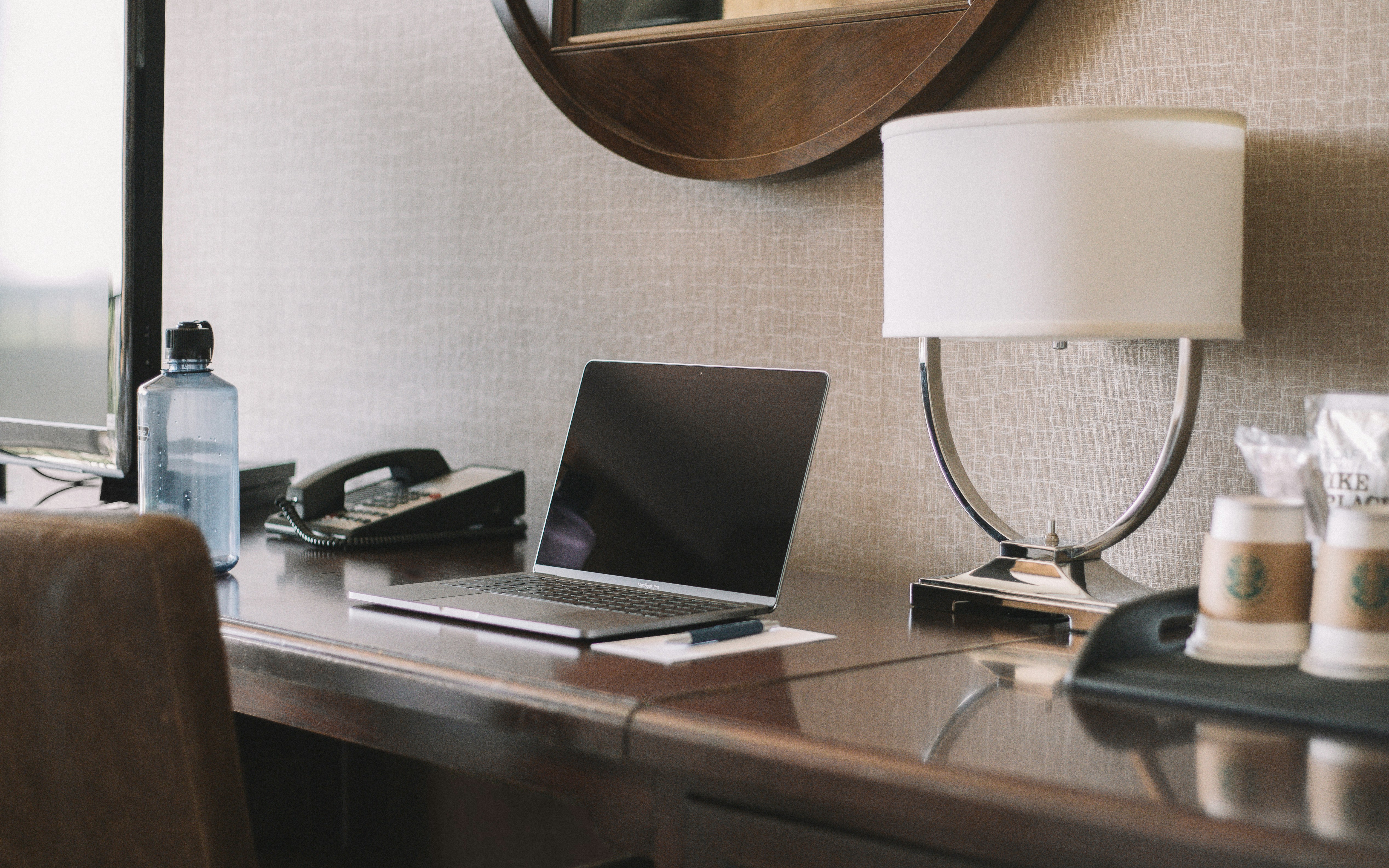 Photo by Unsplash An illustrative photo of a turned off laptop computer on desk beside lamp