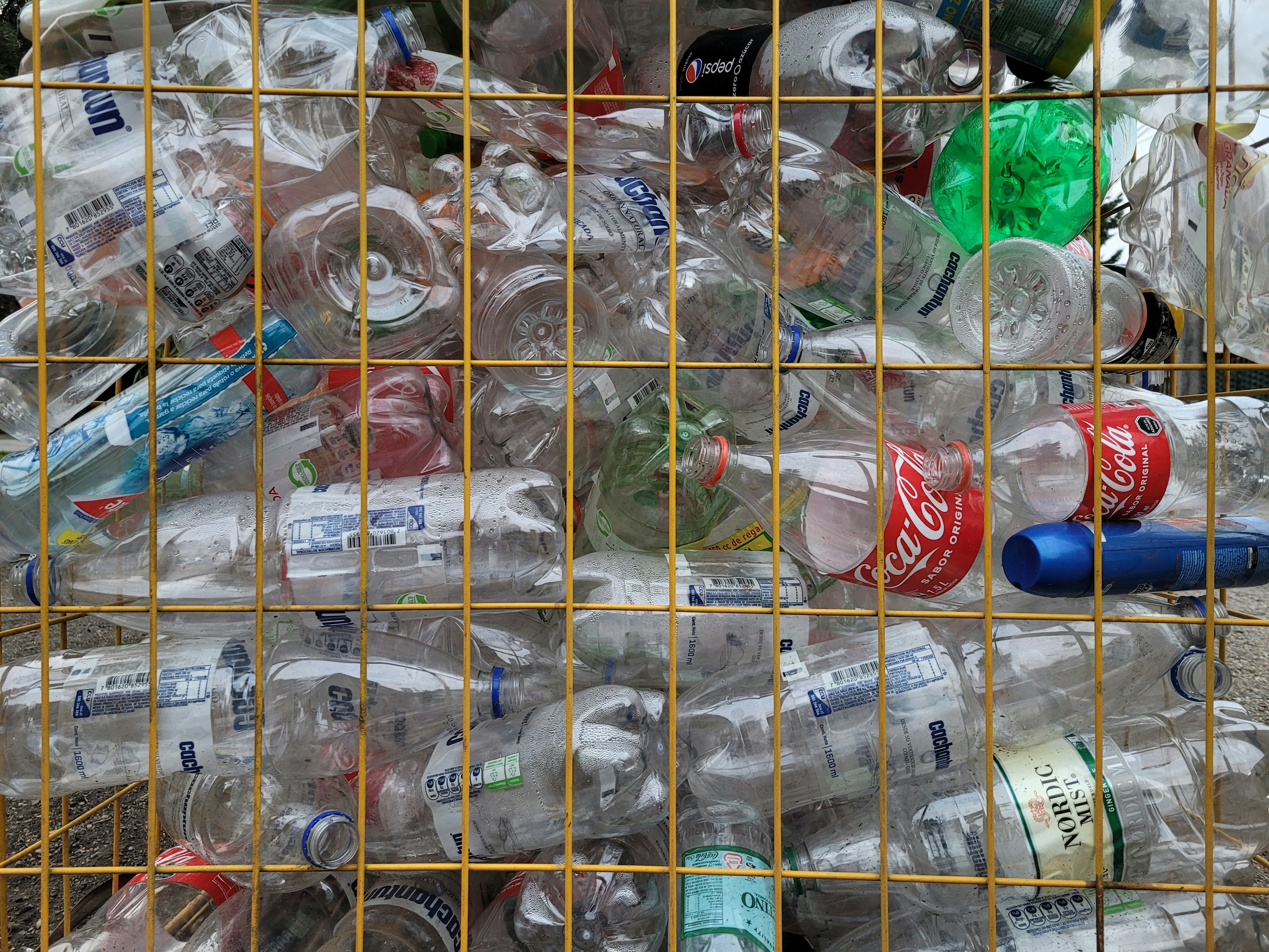 Photo by Unsplash An illustrative photo of bottles in a cage