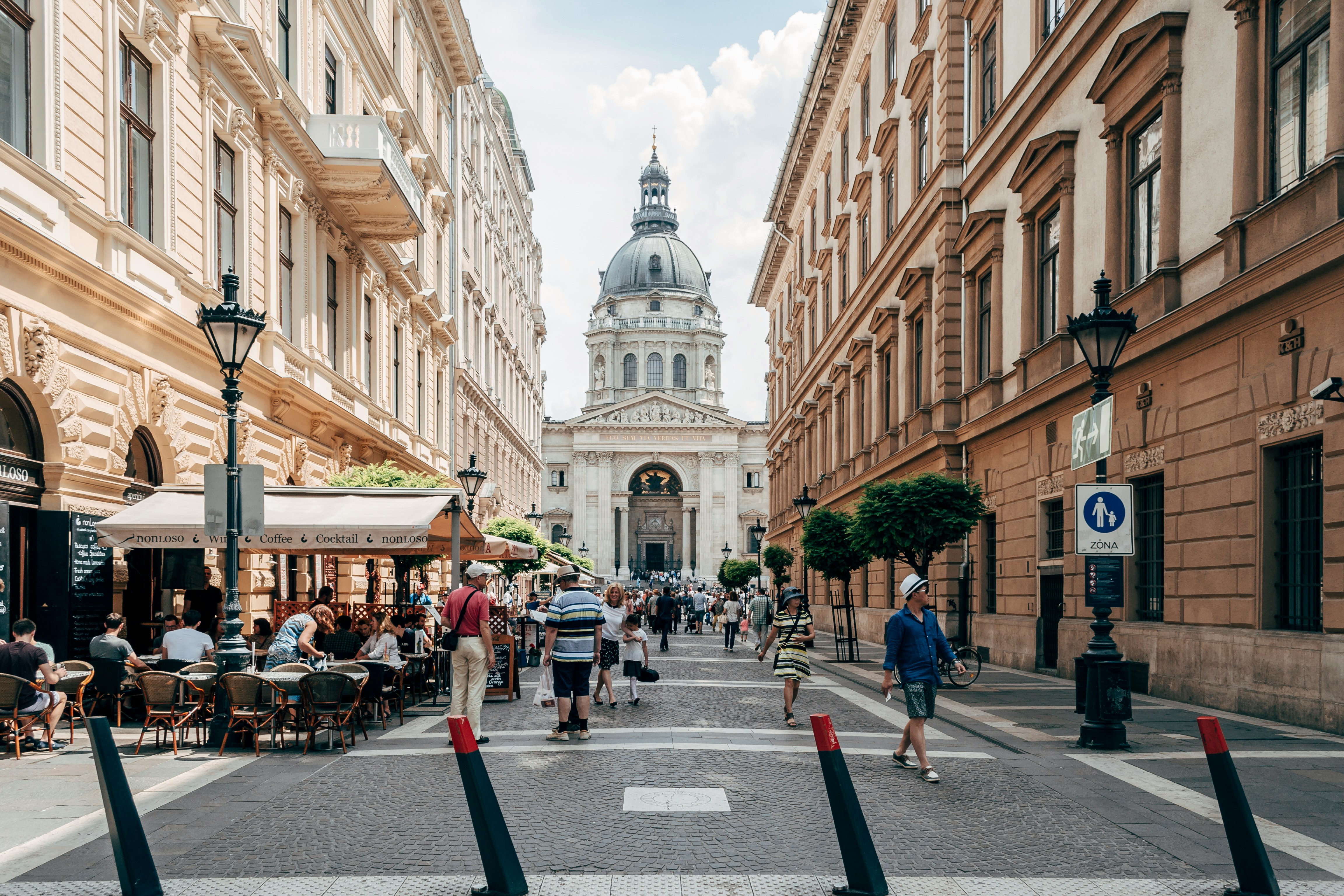 An illustrative photo of people walking on street.