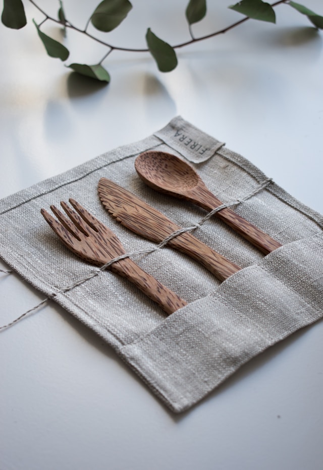Photo by Unsplash An illustrative photo of a set of brown wooden fork, spoon, and knife
