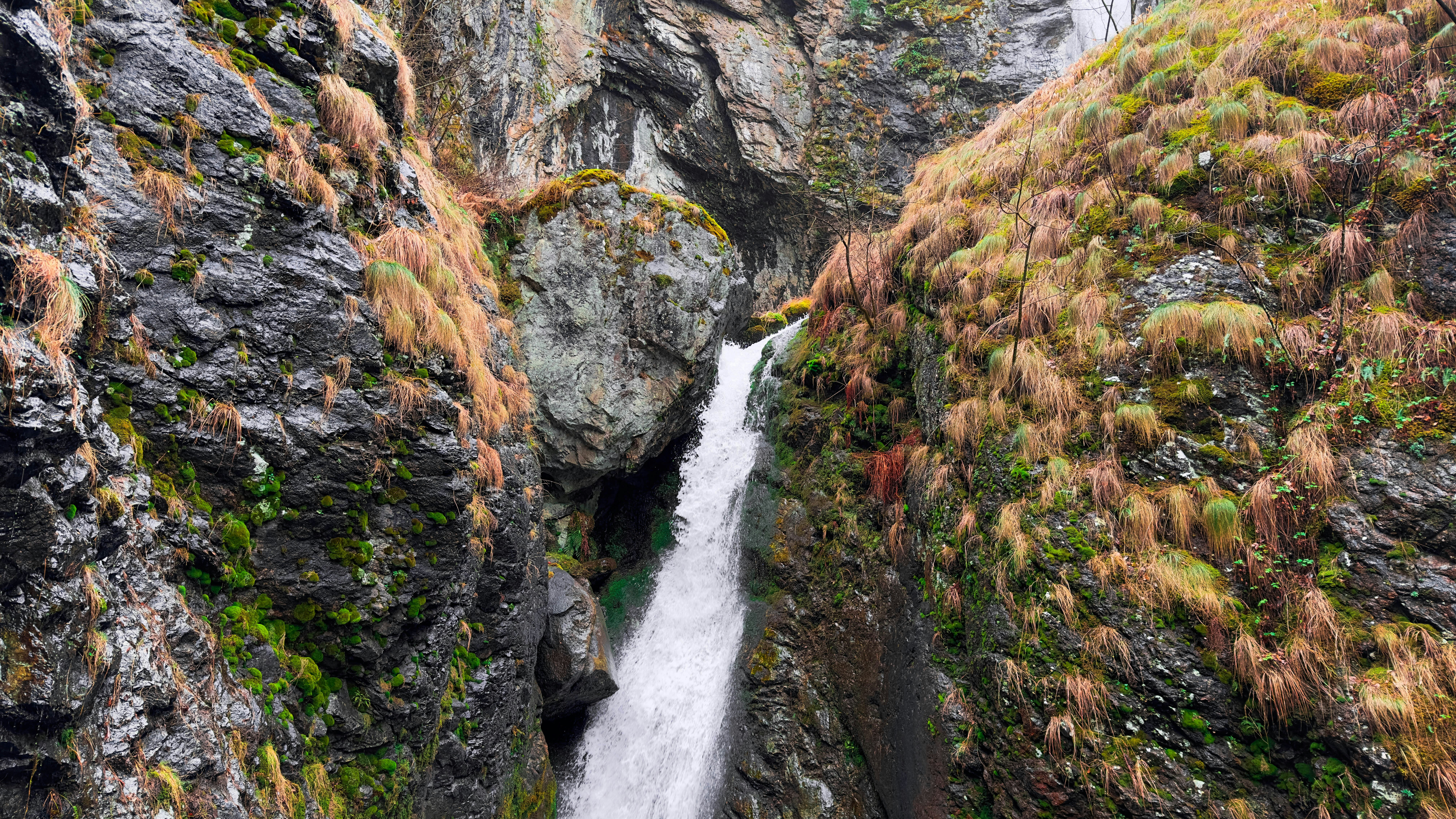 Photo by Unsplash An illustrative photo of a waterfall in the middle of a canyon