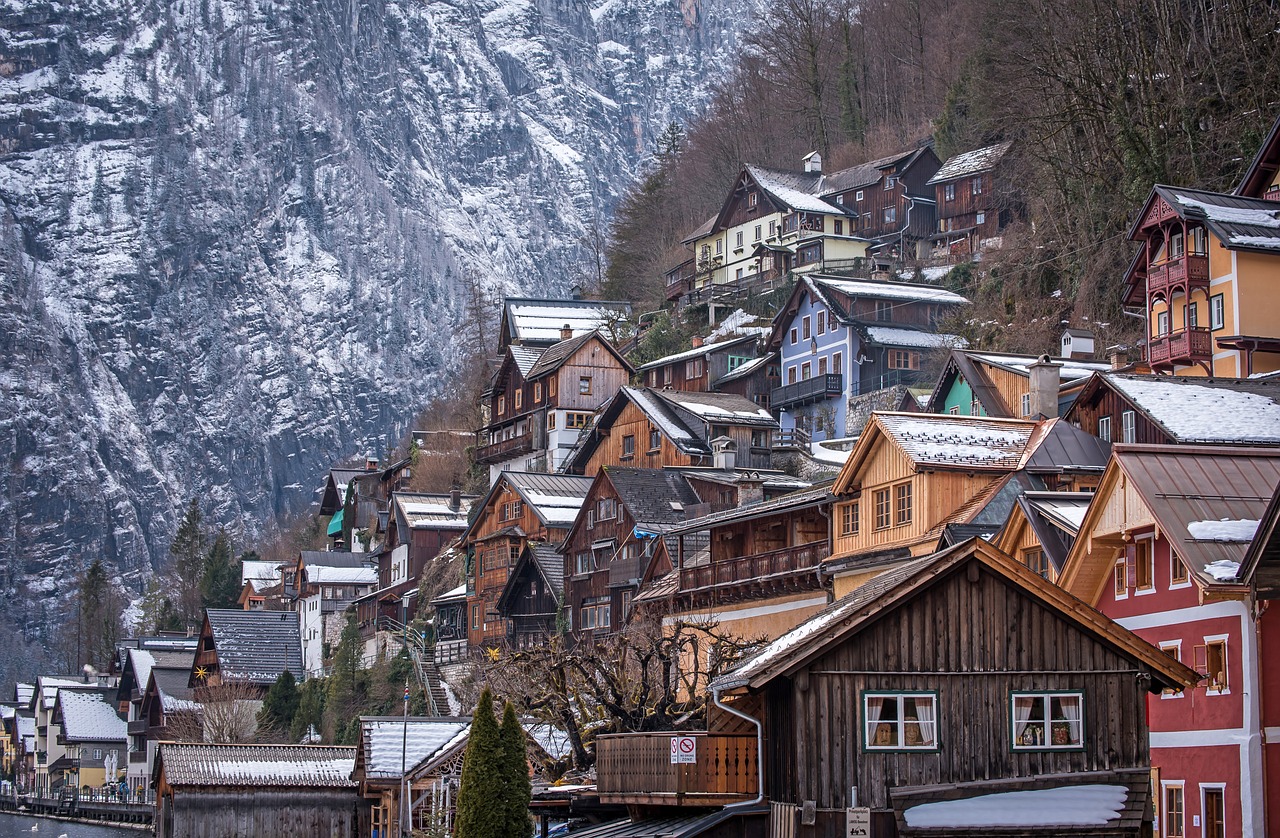 An illustrative photo of houses in mountains in winter.