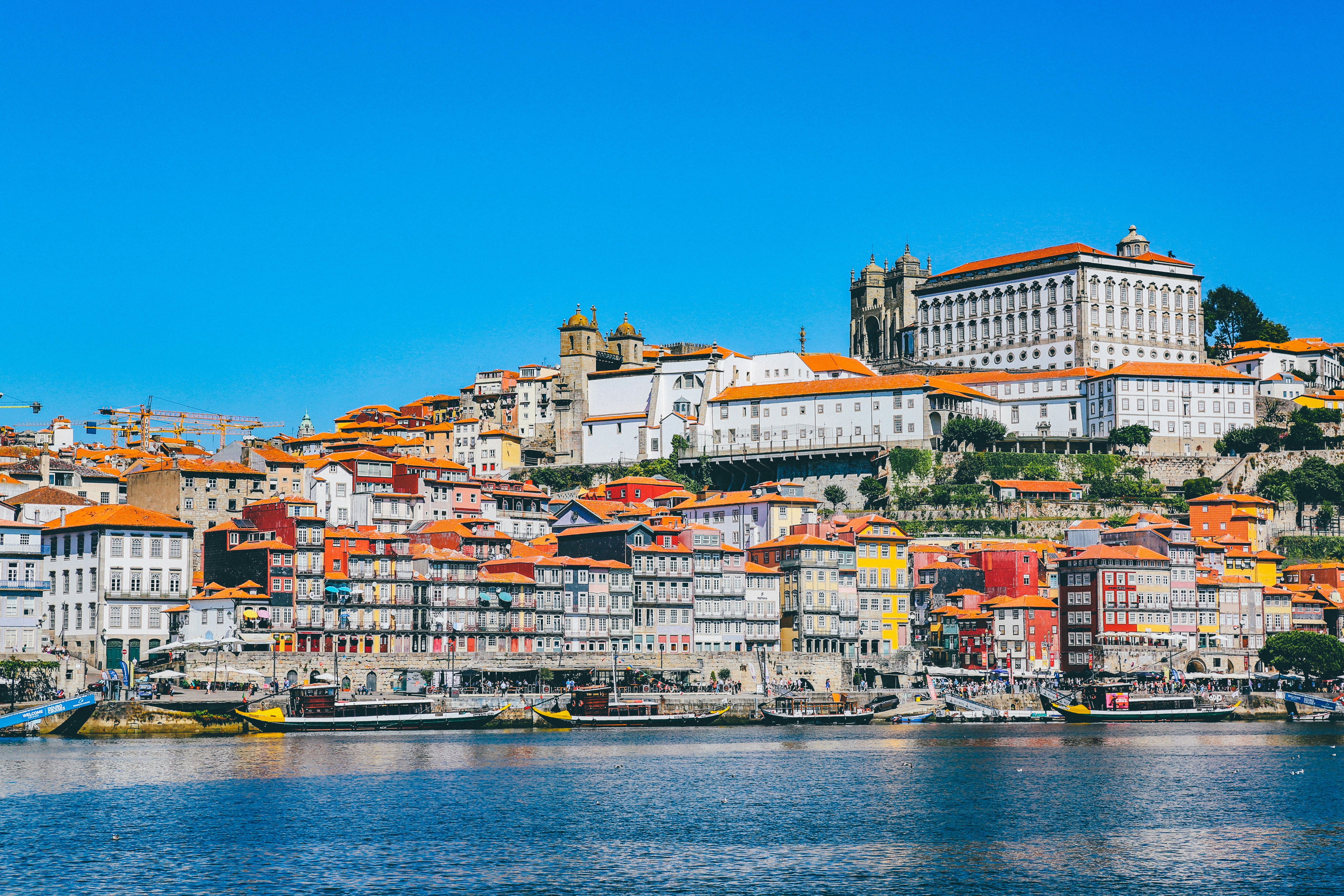 Photo by Unsplash An illustrative photo of houses on the coast near the body of water