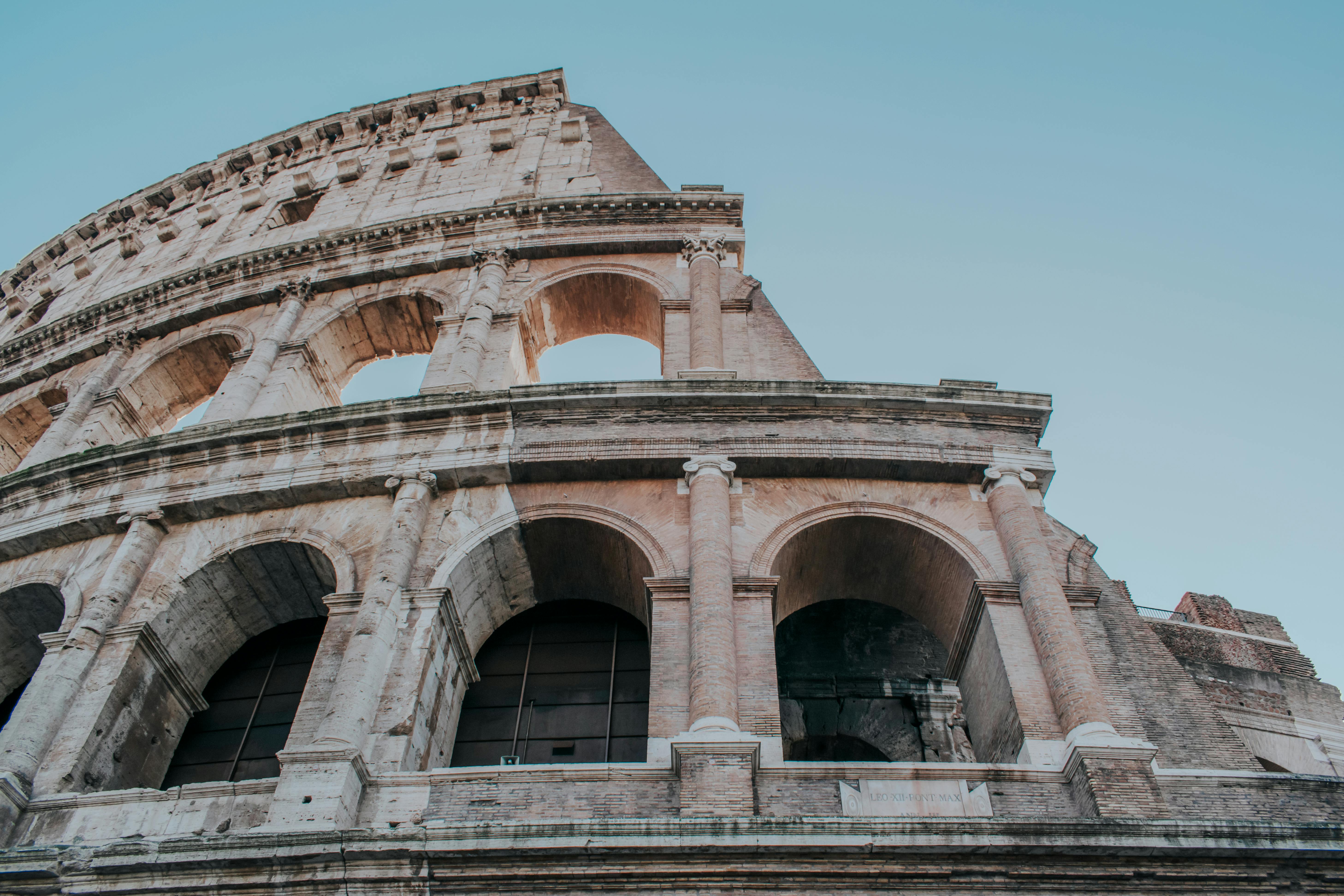 An illustrative photo of colosseum under the blue sky