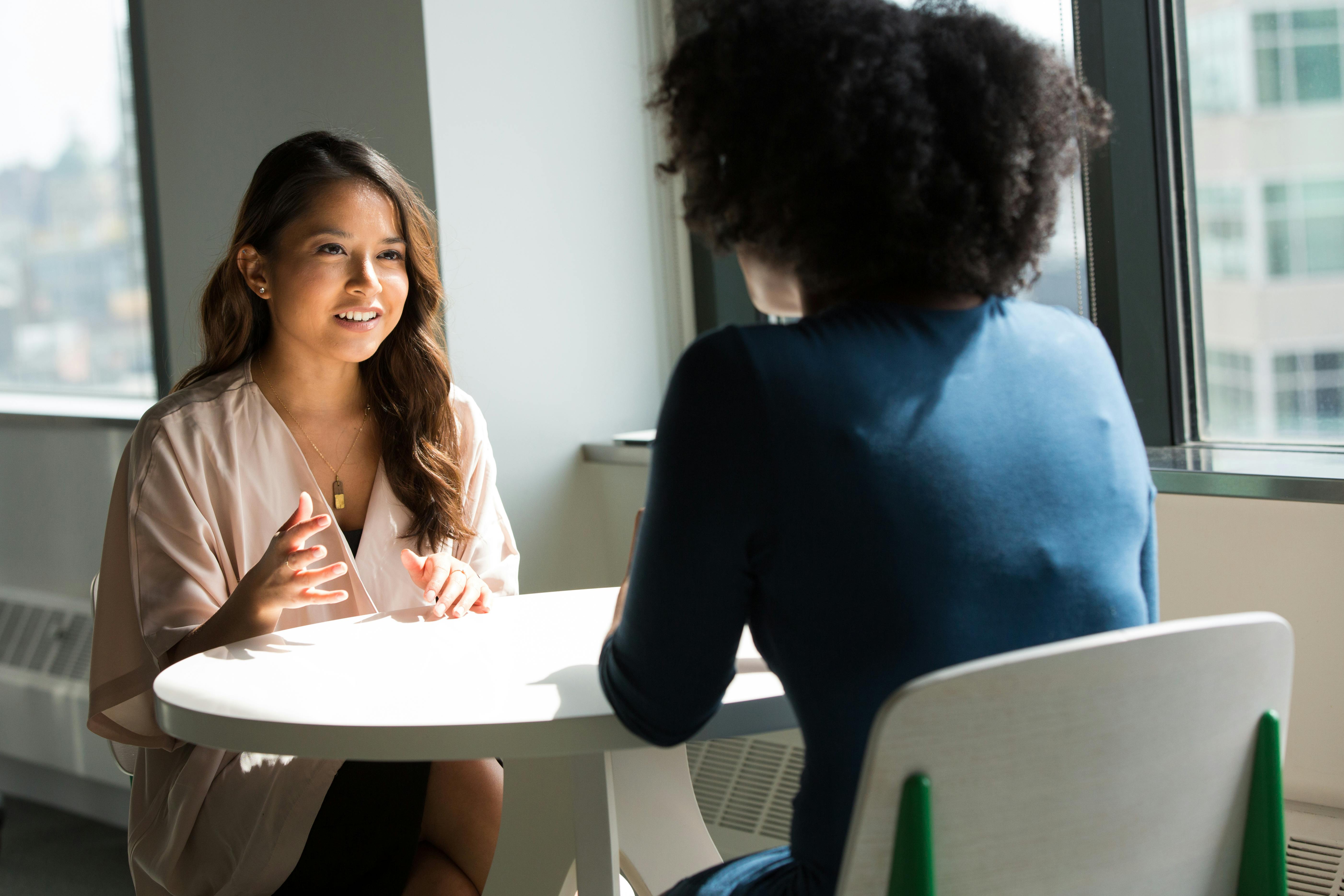 An illustrative photo of two women talking