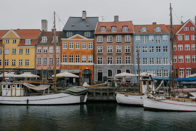 An illustrative photo of buildings lining the waterfront, creating a picturesque scene 