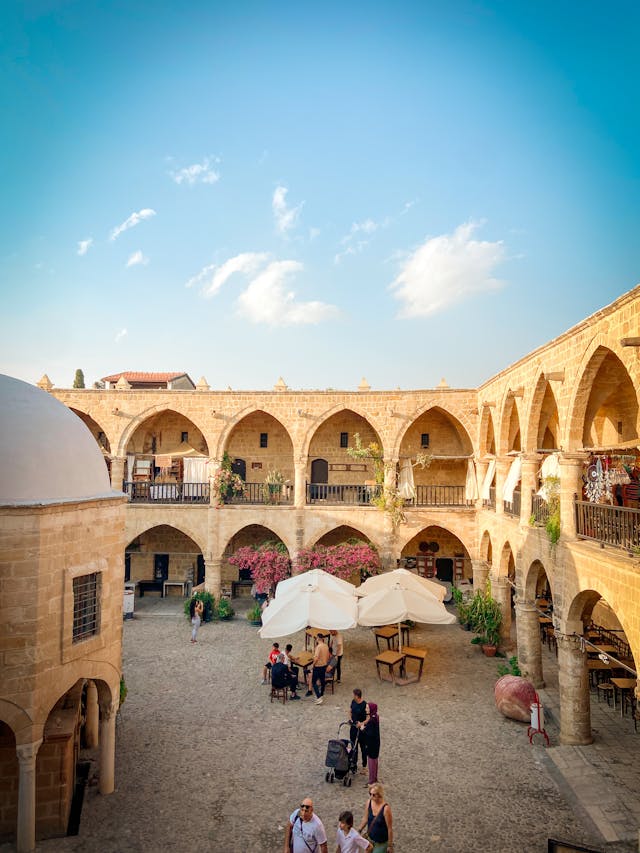 An illustrative photo of a courtyard surrounded by an arched gallery