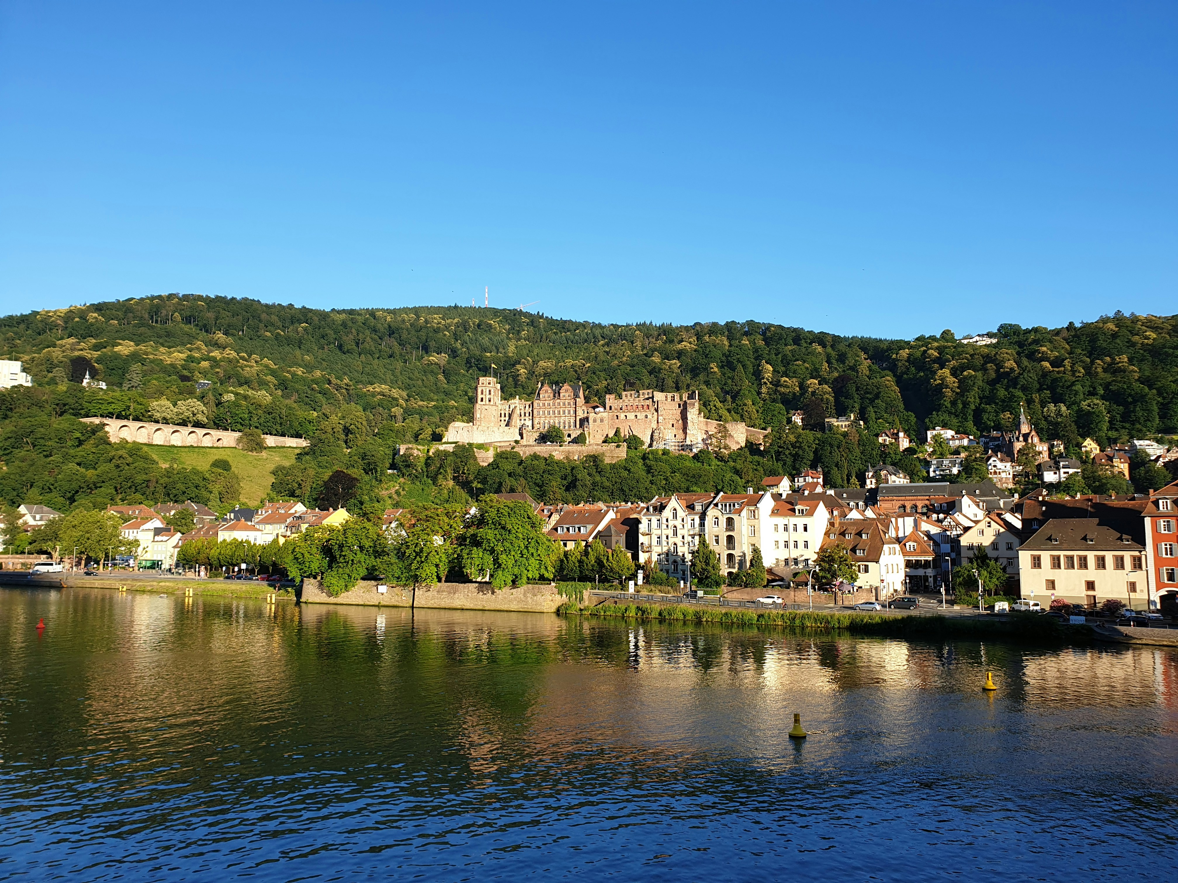 An illustrative photo of a castle on the hill near river