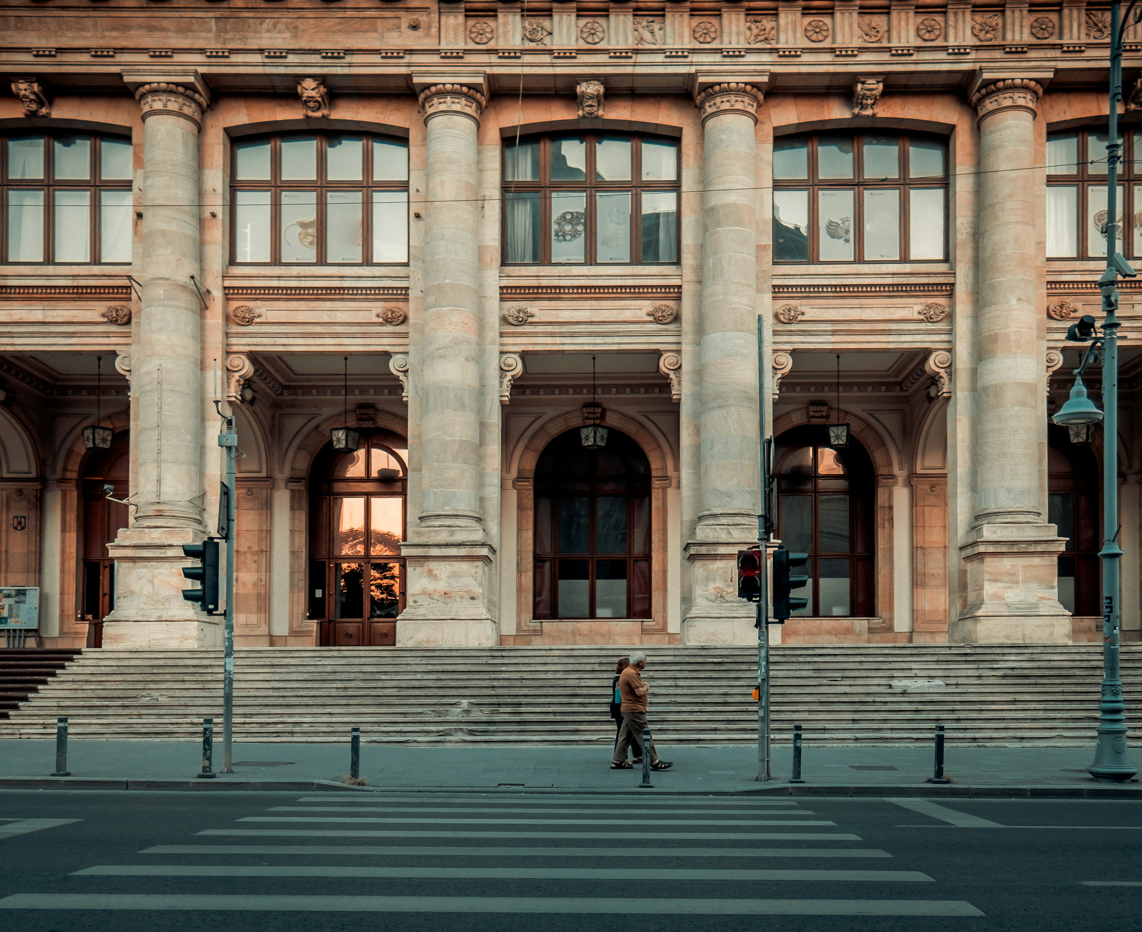 An illustrative photo of a person walking pass building