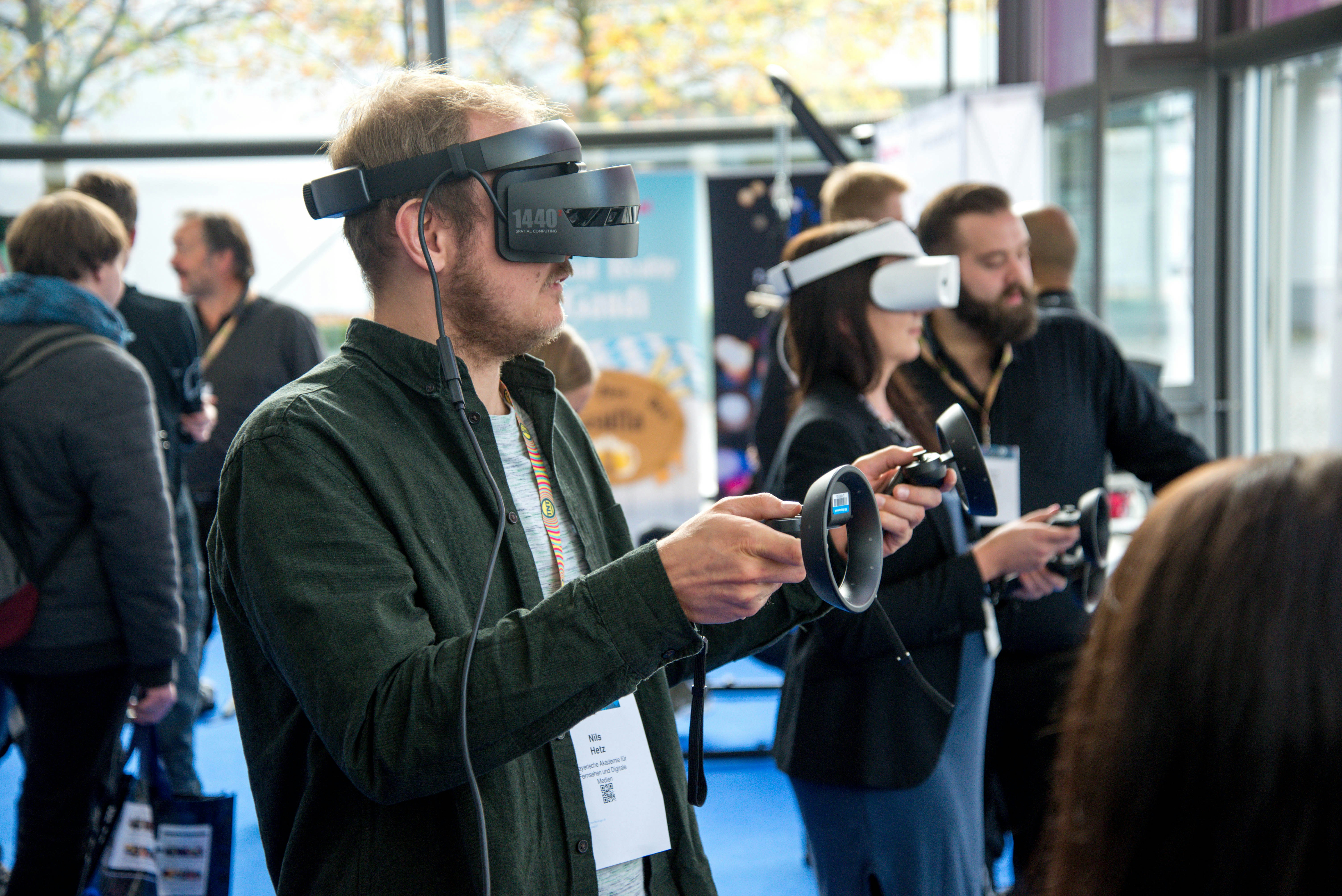 An illustrative photo of a person wearing vr smartphone headset inside room