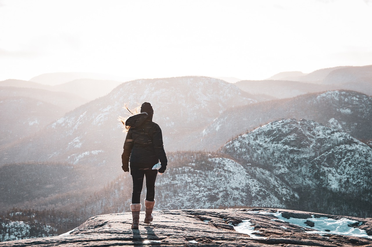 An illustrative photo of a woman in the mountains