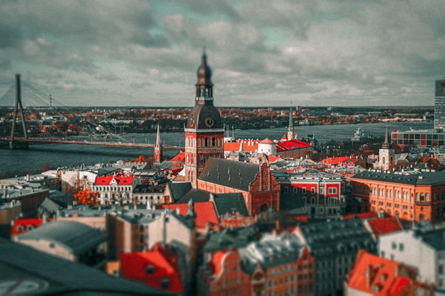 An illustrative photo of a cityscape with a prominent bridge in the background.