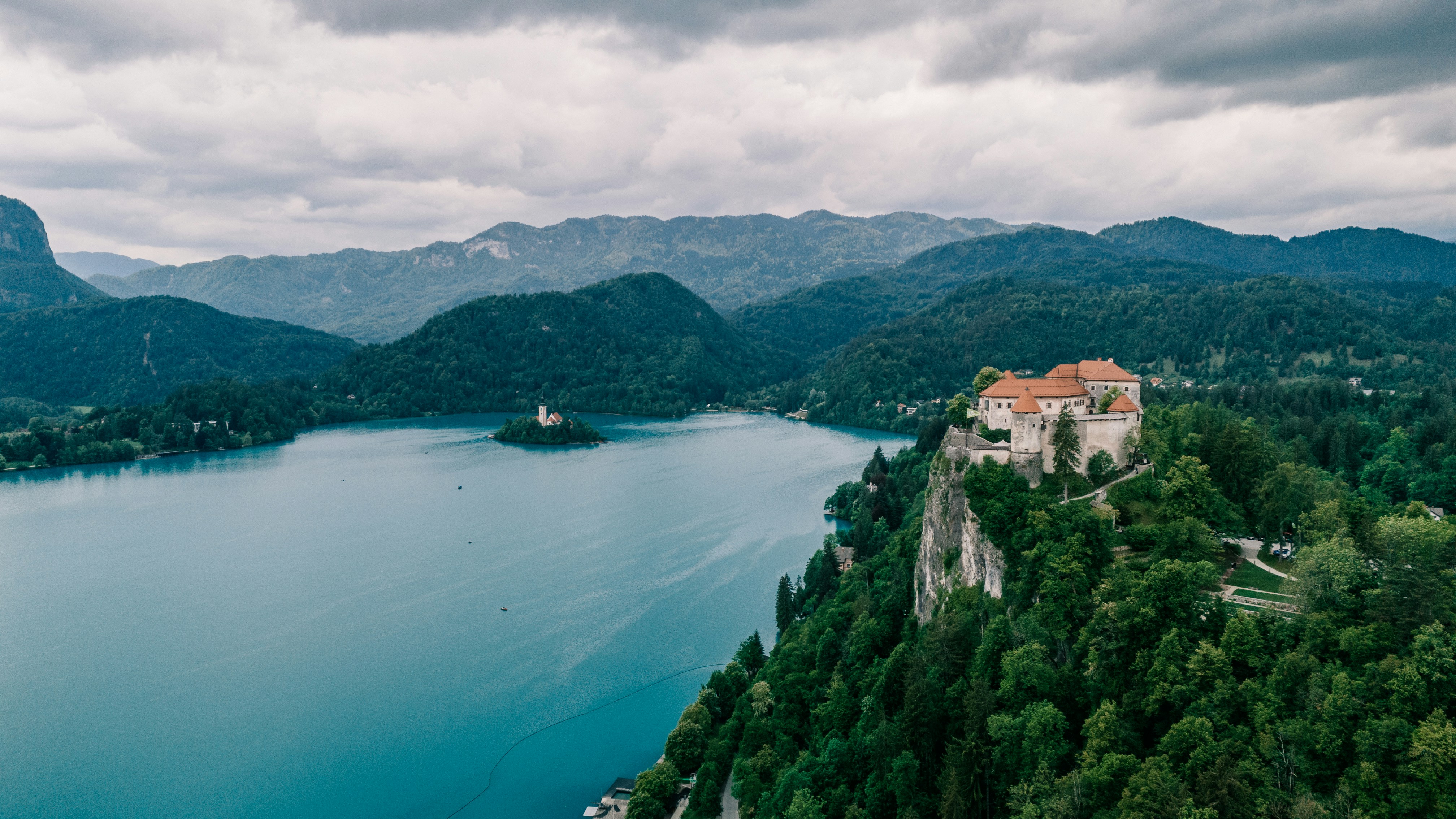 An illustrative photo of a body of water surrounded by mountains.