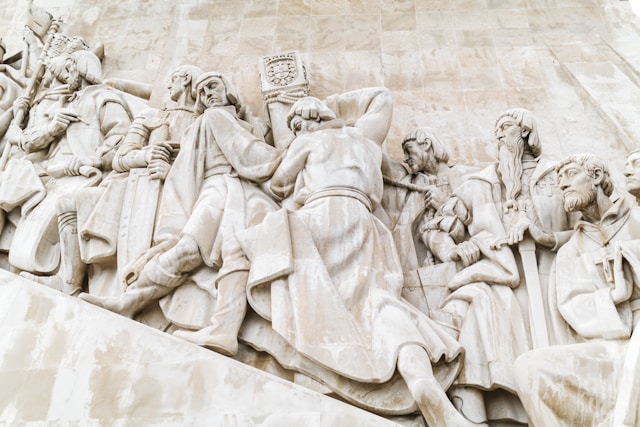 An illustrative photo of a concrete statue of a man and woman standing together